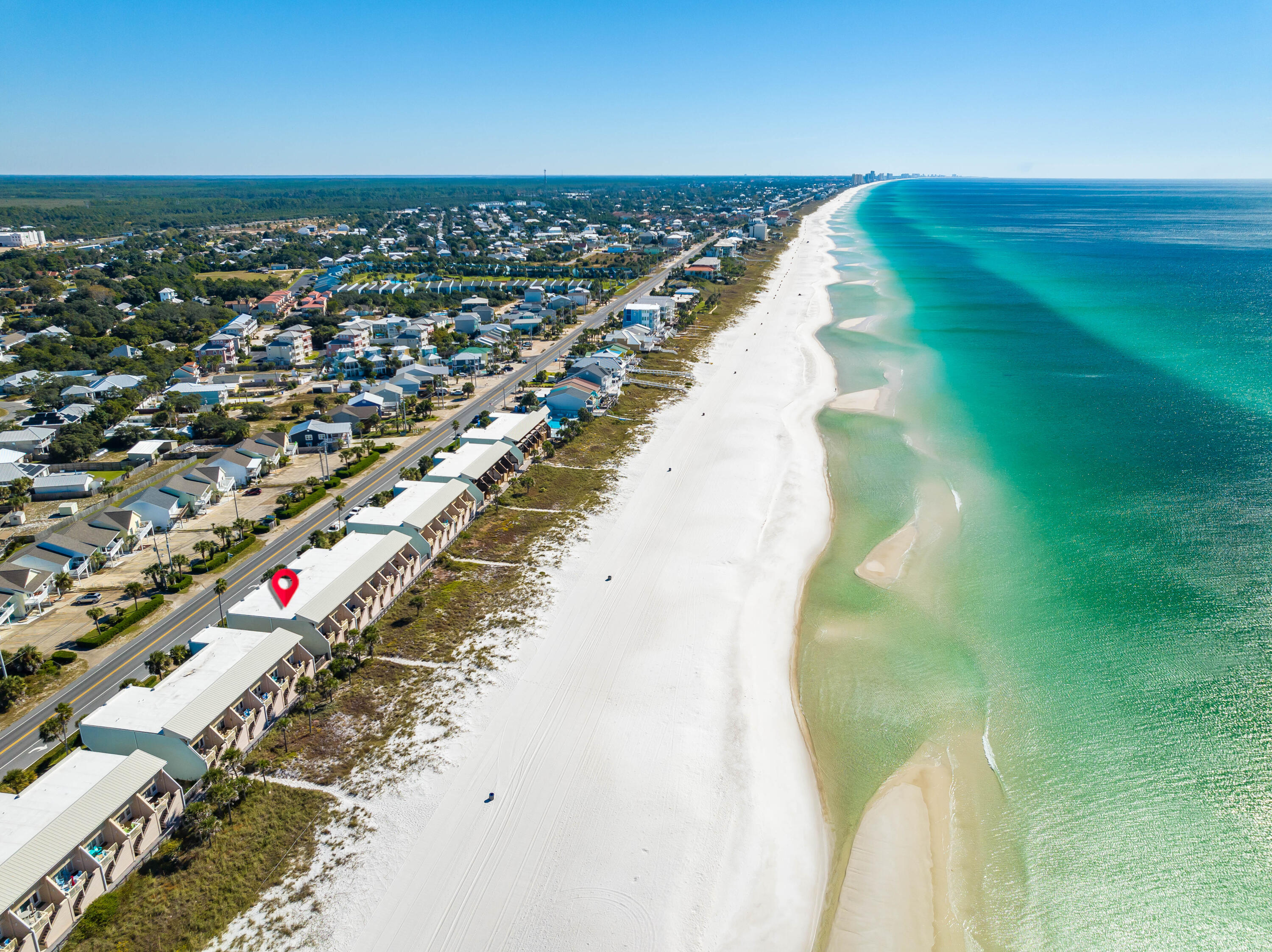 Rare opportunity to own the actual beach with this GULF FRONT 3 bedroom townhome near Carillon Beach and 30A on the WEST END of the beach. Complete with a GULF side Master bedroom boasting panoramic views of the crystal waters with a GULF FRONT balcony, updated Master walk-in shower with custom tile and frameless glass door, huge walk-in his and hers closet, new LVP flooring throughout, custom plantation shutters and a private garage with plenty of storage. Additional features include a SimpliSafe security system, Solar Screen/Hurricane shutter system on both main and upper levels for solar and hurricane protection benefits. This townhome is environmentally friendly with  a Geothermal condenser and air handler upgraded to a 4 ton unit; saves big on energy! A PROPERTY WIDE BEACH FRONT RENOVATION PROJECT is underway to extend the garage and Gulf Front Balcony an additional 4'. Project to include new exterior hardi plank siding coming on beachside and end walls as well as new hurricane impact windows with new extended decks. Seller has already paid for the bulk of this project ($60k). This is the ideal vacation home for owners and guests alike making the Shores a lucrative rental investment or second home at the Beach. PROJECTED UP TO $96k ANNUAL GROSS INCOME!