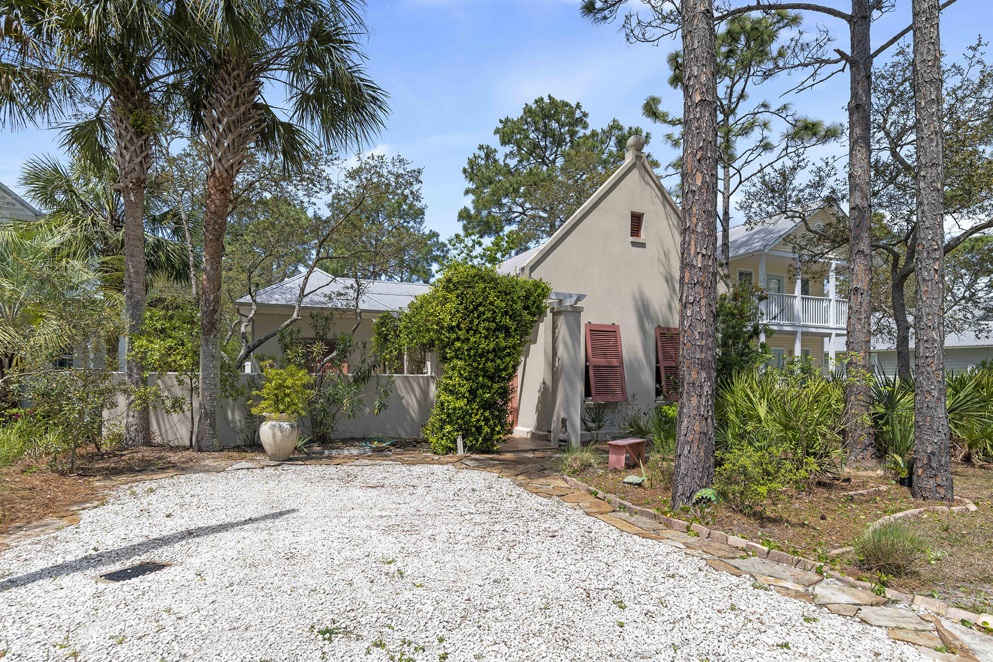 Custom built concrete home just a short stroll to the beach in Seagrove. Welcome to 181 San Juan, a meticulously maintained home that has never been rented by the current owner. Enjoy single level living with an open floor plan kitchen/dining/living room, perfect for entertaining. Vaulted ceilings in this area along with the master bedroom add architectural beauty. An abundance of built in shelving compliment the gas fireplace, perfect for cooler winter nights. For those hot summer days, the backyard is a private oasis with potential room to add a swimming pool. The front yard has a beautiful courtyard area that is designed for both relaxation and gardening. Updates include but are not limited to 2022 new AC, updated dishwasher, washer, dryer, toilets, countertops, gas cooktop, wood flooring, carpet in bedroom and shed with generator. This home is a direct stroll south, approx 0.2 miles to the S San Juan beach access. Although the home has been used as a primary residence, it would make a fabulous investment property or second home. Gulf Shore Manor offers convenient Seagrove living with no HOA fees and a voluntary POA.