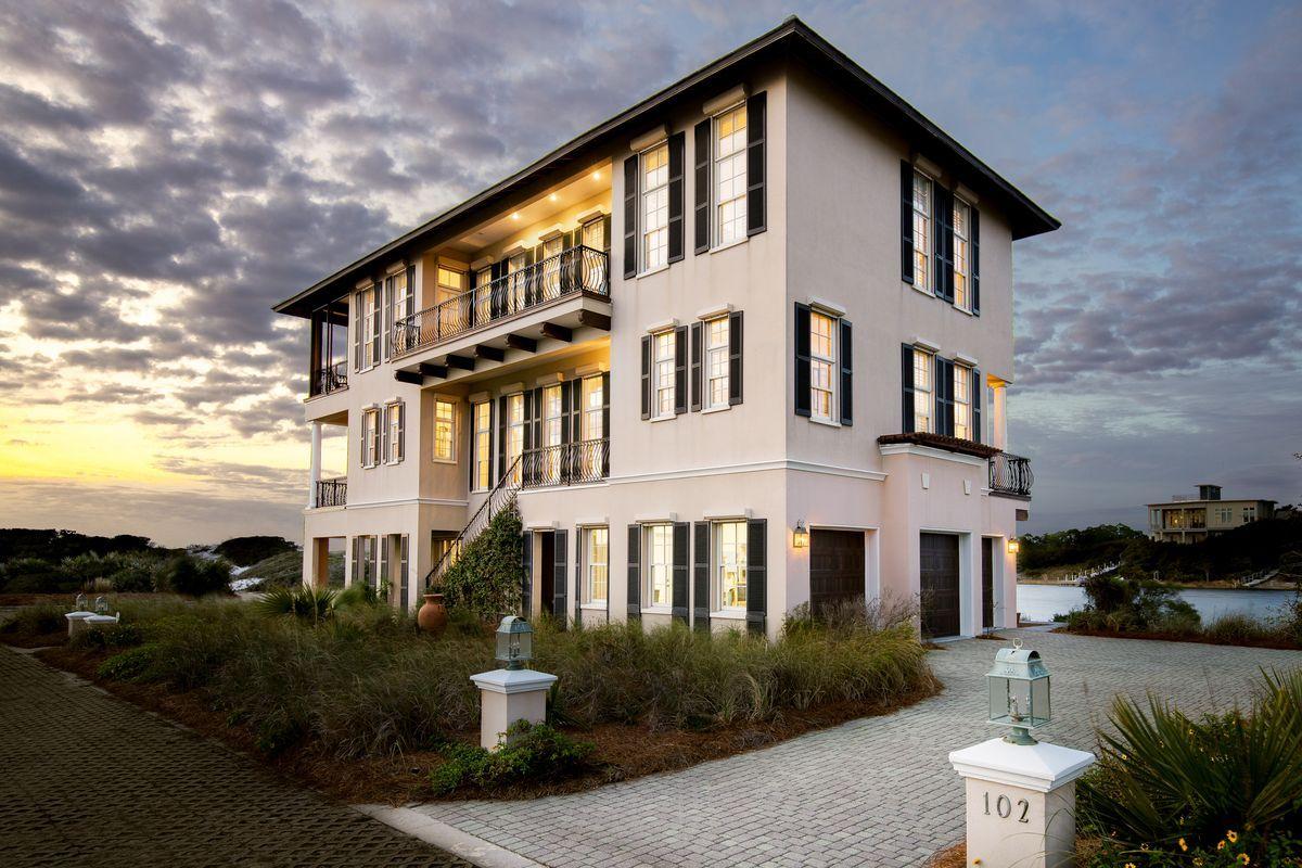 Panoramic views and a waterfront lifestyle adjoin to provide a unique ownership experience at 102 Stallworth Boulevard. This Italianate inspired lakefront home boasts a reverse floor plan with elevator for pure enjoyment of the natural surroundings as well as four master suites, each with dual vanity en-suite baths, balcony access and water views of the Gulf of Mexico to the South, and Stallworth Lake to the North. 12-foot ceilings soar throughout the second and third levels of the home while Rosewood flooring on these levels provides warmth to the crisp French Country inspired interior. Expansive windows ensure that natural light is prevalent during your days of lakefront enjoyment, and a geothermal HVAC system provides cost-effective heating and cooling throughout the 4,400+ square foot property. A full-floor bunkroom and additional living room on the lower level provide plenty of space for multi-generational enjoyment.  An oversized three-car garage adds additional convenience, while three levels of outdoor living gift owners with a truly remarkable coastal living experience. 

Stallworth Preserve is a unique community of Gulf front and Lakefront custom homes, isolated just west of Beach Highlands. Deeded beach access for owners ensures hours spent along the sandy shores are always within reach, while this non-rental community enjoys State Preserve status, ensuring meticulous attention to the surrounding vegetation.