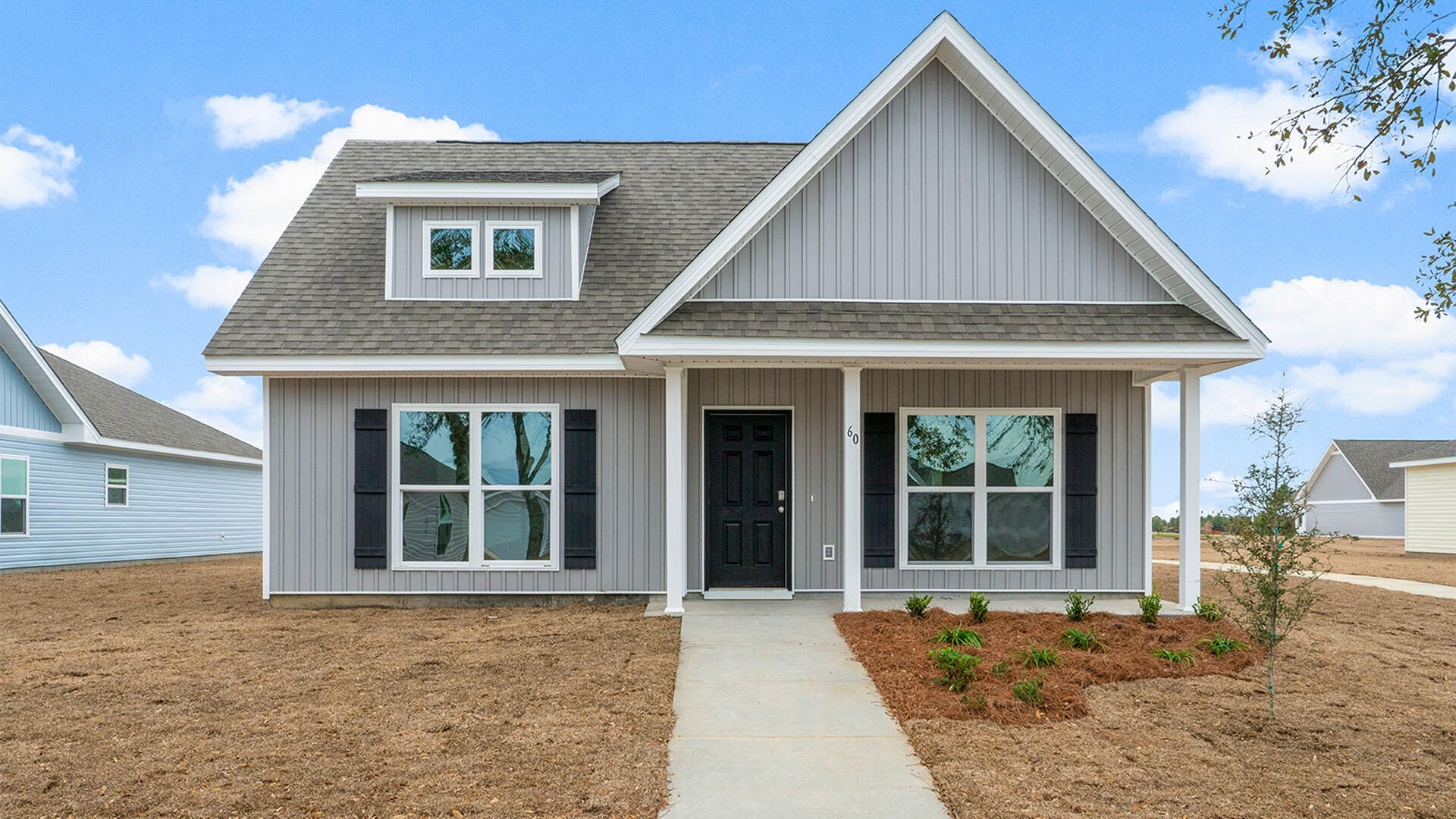 The Owl's Head community is conveniently located off of Highway 331 in Freeport.  We are only 8 miles to Interstate 10, and 16 miles to beautiful beaches and Highway 30 A.  We offer 6 floor plans, 3 and 4 bedrooms.  All homes have rear entry garages.  This community offers a community area with paved walking trails and a spring fed lake. | The Bayberry plan is a single story 3 bedroom, 2 bath home.  This open floor plan features a covered front porch and a very large primary bedroom. The primary bathroom has a large shower, and a  spacious closet off of the bathroom.