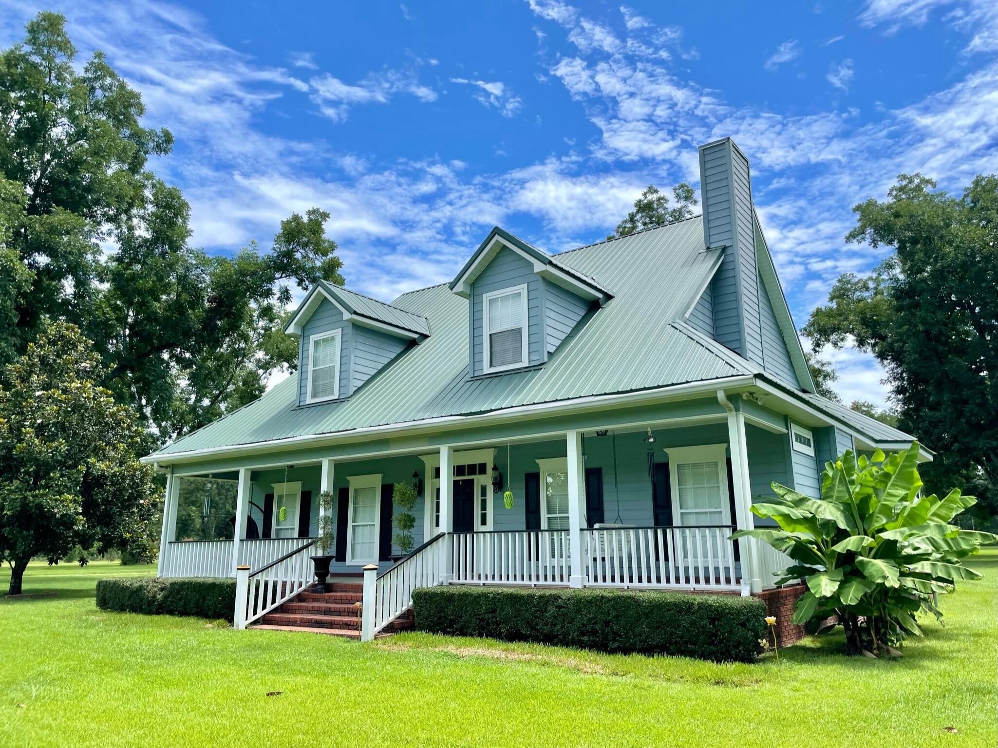 If you're looking for peace & quiet on just over 10 acres, a large home with 4 bedrooms, 2.5 baths, a bonus room, and 2 car garage, this is a must see. Home boasts of natural light and space. Master suite is downstairs. Master bath has double vanity, two spacious closets, shower, jetted tub, and a separate toilet room. Kitchen is equipped with stainless steel appliances to include an oven with bun warmer & ample cabinet space. Half bath and laundry room are also on first level. Laundry room can be accessed from garage, master bath, and kitchen. Living room has built in shelves/cabinets & a gas fireplace. The 3 bedrooms, bath, and bonus room are upstairs. Sit on the front porch & enjoy pecan trees or the screened porch & enjoy fruits trees. Outside you'll find a 24x72 workshop with five roll up doors, one of those being tall enough for an RV. Plus enjoy a 24x40 pole barn for additional storage. Metal roof completed in May of 2019. Home is on private well and septic. Septic pumped in 2022, new well pump in 2018, and new HVAC in 2018. Buyer to perform all due diligence.