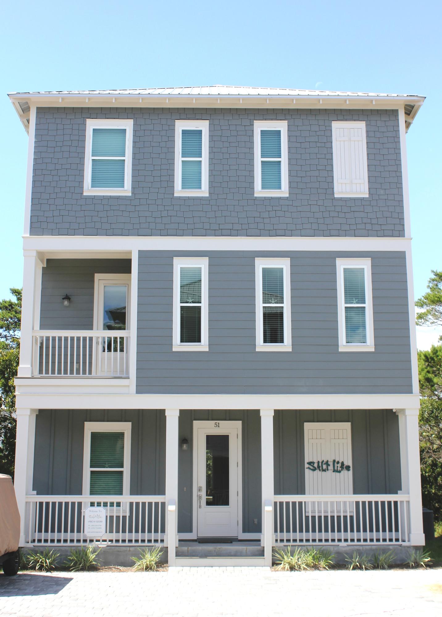 This custom home offers luxury coastal living in the highly desirable Coastal Grove development just off intersection Hwy 393 & Co Hwy 30A. Gated entry to neighborhood offers privacy & minimal traffic, yet is surrounded by FUN! Just around the corner & a short walk to Gulf Place with restaurants, shopping, festivals, concerts, Shunk Gulley Oyster Bar, & Ed Walline park (public beach access is beautifully kept. Amenities include bathrooms, pavilion with picnic table, showers, handicap access, & free parking). Florida Cottage design includes hardy board exterior, metal roof with exposed rafter tails, cozy front porch, & balconies in front/back. Once inside, this effect continues with the charming coastal style furnishings & dcor throughout. Quality is evident with high ceilings, crown molding, porcelain plank flooring, stainless appliances, granite countertops, & intricate tilework. Every room bright, airy with many windows & unique lighting. 
Two bedrooms with full baths and bunk bed nook (which could be designed as a recreation or TV area on the first floor.  Open kitchen and living room on second floor.  Master bedroom with gulf view on 3rd floor.  Patio made of pavers in back for cookouts and entertaining. Walk home from the beach and wash off the sand in the back patio shower.   
No HOA and no rental restrictions. This home has been on a vacation rental program with gross rental income of $60,000 per year for two years.