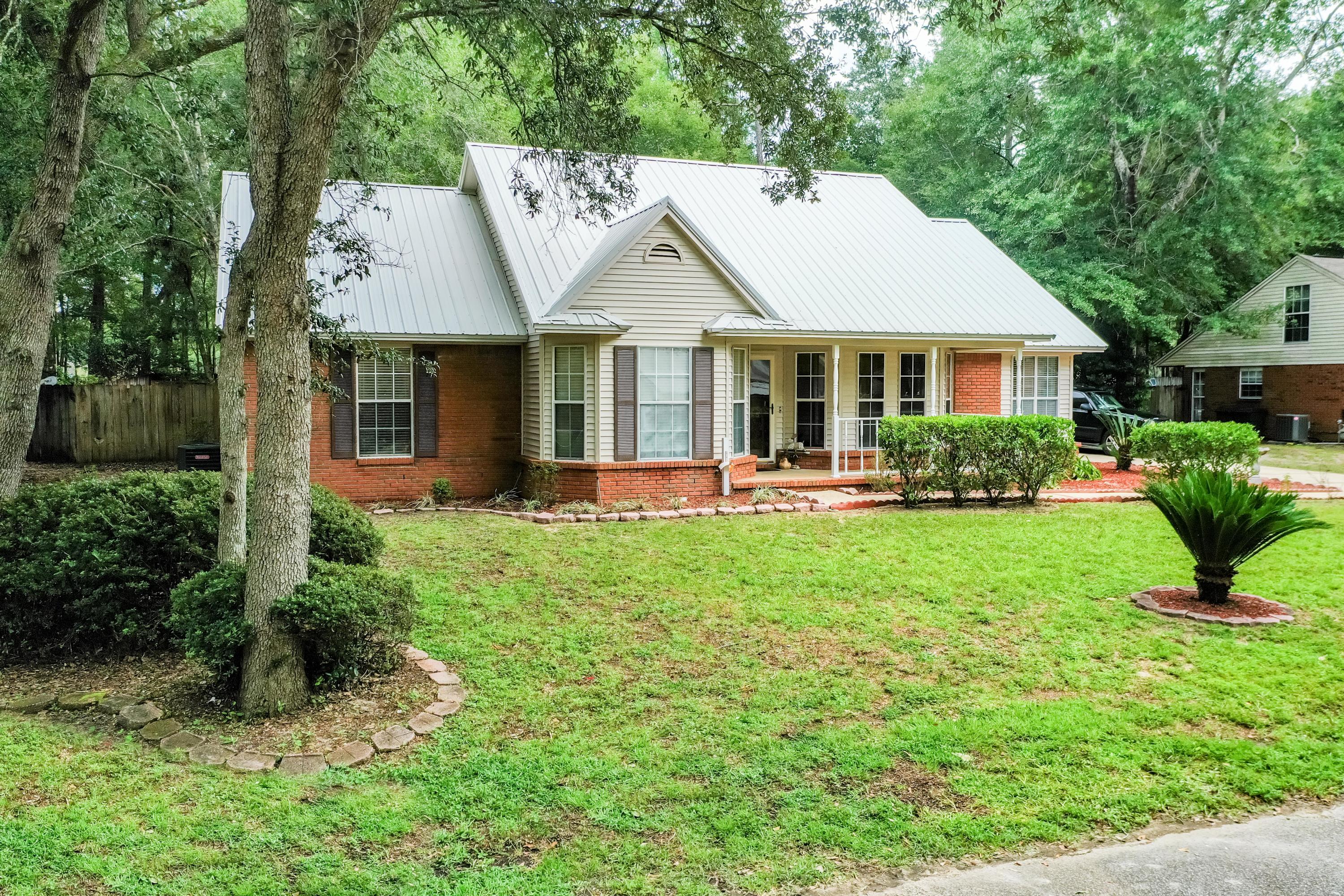 Affordable, Adorable, and Accessible! Located on the south side of Crestview, south of I-10. The tiled Foyer opens to both the Dining Room with French doors and the Great Room that has a Vaulted Ceiling and corner, gas Fireplace. Popular wood look tile flooring except in the carpeted Bedrooms and Bonus Room. Kitchen is fully equipped with all appliances and is accented with a beamed Cathedral Ceiling. 1st floor Master Bedroom Suite is complete with Walk-in Closet, Separate Shower, whirlpool Garden Tub, and double vanity. Upstairs Bonus Room could be used as 4th Bedroom. Screened Porch opens to the Privacy Fenced Back Yard. Stove is electric but there is a gas hookup if you prefer a gas stove. Home Warranty provided by the Seller, a $450 value. Be sure to take a look at this Home! Sprinkler system is not operational-''AS IS''.