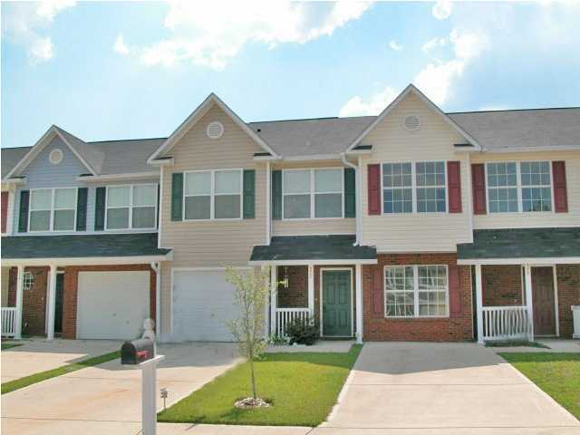 Come see this 3BR/2.5BA townhome w/ brick front accents, decorative shutters and covered front porch...this is just part of the low maintenance lifestyle you will enjoy in a neighborhood with sidewalks and underground utilities. The Sanddollar floor plan has a spacious open living area on the first floor. The entry has laminate wood floor and a full size coat closet. The kitchen has all appliances including a refrigerator w/ice maker, pantry and breakfast bar. The dining area has double french doors to the open patio out back. The open living room is perfect for entertaining friends and family with a convenient half bath, allowing more privacy for the bedrooms upstairs. At the top of the stairs is a full bath and two additional bedrooms.