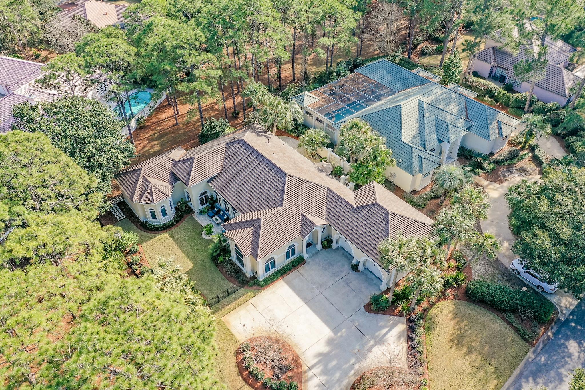 Captivating Single Story Sandestin Home! Beautifully remodeled to include 4 bedroom and 4.5 bathrooms with 3452 sqft - all on one level. Enter the foyer with 20' ceilings and then into an amazing open entertainment oasis with dining, kitchen and living area (with room to dance) covered with new wood look tile, and a courtyard on each side. Modern kitchen w/Monogram and Bosch appliances, custom cabinets throughout, large kitchen island with a farmhouse stainless sink and gorgeous granite w/room to seat 6, step right outside to grill or enjoy outdoor dining. Adjacent is the light & bright living area with a wall of windows flowing to the second patio/courtyard over looking the neighborhood green space. Beautiful furnishings available outside of home purchase. Master bedroom has a pair of corner windows and then leads into a glorious master bathroom with double sinks plus a makeup station, modern soaking tub and separate large tiled shower. There are 3 additional bedrooms, the front one is large enough to double as a seating area, both the 3rd and 4th bedrooms are ensuite with their own full bath. This is a insulated concrete form construction custom home that was additionally customized by the current owners a MUST see! Anderson windows throughout, geothermal heating & cooling system for lower power bills, large attic, 800 sq. foot garage with storage room, sprinkler system for the lush and mature landscaping. 
Enjoy all that Sandestin Golf and Beach Resort has to offer, it is a major destination for all. This resort spans over 2,000 acres and features miles of beaches as well as bay frontage, 4 golf courses, tennis center, 2 resort pools, marina, fitness center and The Village of Baytowne Wharf, a pedestrian village with dining, shopping and events
