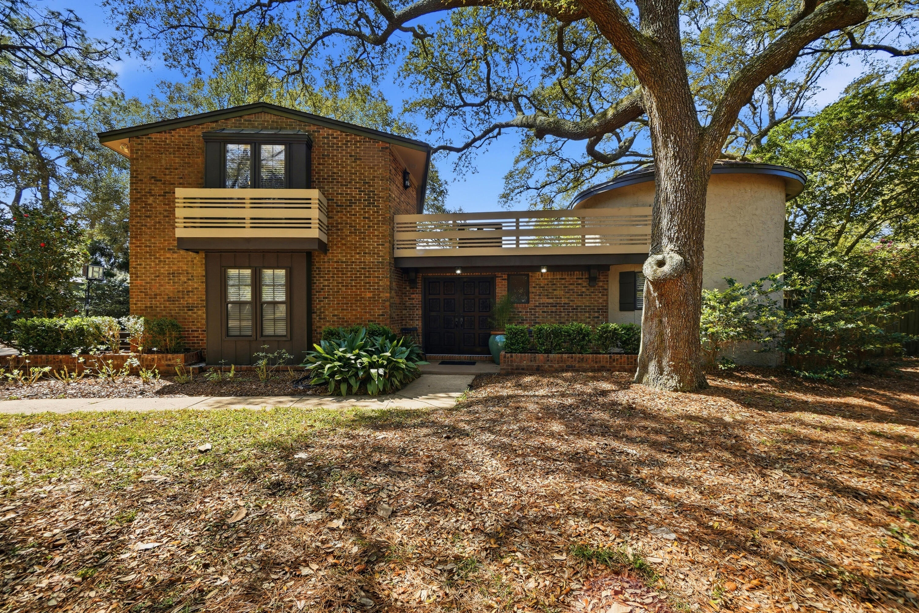 No fault to the seller. But....back on  the market. Come see this beautiful Tudor style home on a half acre lot, overlooking the Rocky Bayou golf course. This is hidden gem, featuring timeless architectural charm, 2 spacious living areas, and a private backyard oasis with a pool and outdoor shower. Enjoy mature landscaping, and a layout perfect for both relaxing and entertaining. A rare blend of character, comfort, and a prime location.