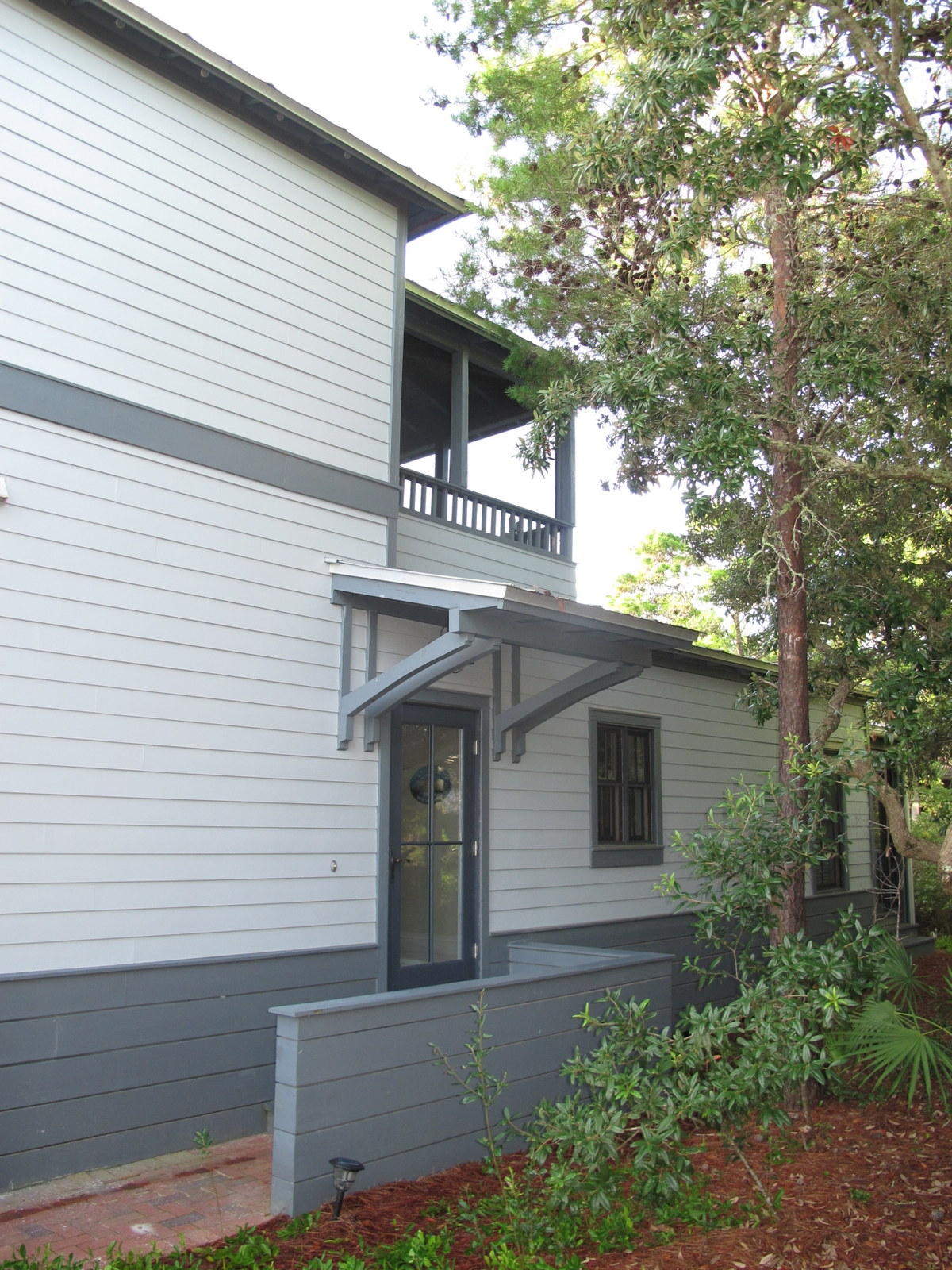 Cozy and charming beach cottage in the desirable neighborhood of Magnolia Cottages by the Sea only a 5 minute walk to the beach! Popular with renters and second homeowners alike, this neighborhood features brick paver streets, a community pool, and deeded beach access along with golf cart parking near the beach. It is also near the communities of Alys, Rosemary, and Seacrest Beach for lots of options for dining and entertainment.
Featuring hardwood floors throughout, this beach house offer three bedrooms and three baths. A second floor private master suite with walk-in closet and double vanity has its own covered and screened porch overlooking the tree tops. Two bedrooms are downstairs, one with en suite bath and the second shares a convenient full hallway bath. This floor plan is great for family gatherings. The open living, dining, and kitchen area opens out to a large screen porch with room for seating and outdoor dining options. The home has lots of privacy offered by the lush, native landscaping and is also very convenient to the community pool. An outside storage area and outside shower complete the home and make for easy trips to and from the beach. 

Although not currently on a rental program, this beachy cottage would make an excellent vacation rental home. Sold furnished with some exclusions. Rental Projection under Documents tab.