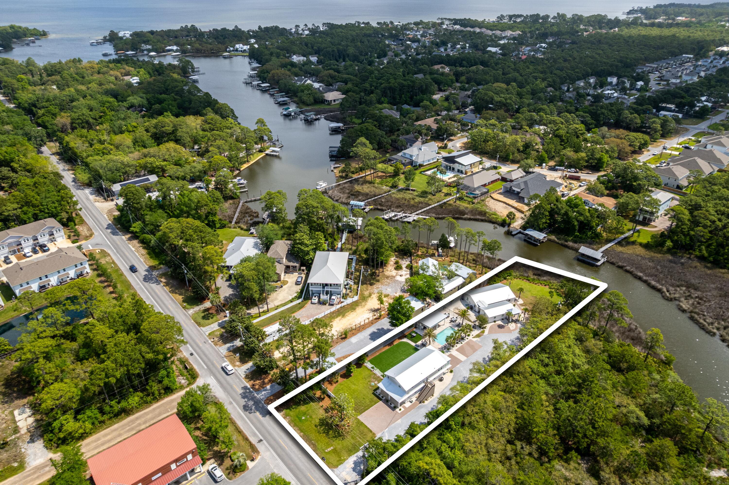 Incredible Investment Opportunity! This 100' waterfront property on Mack Bayou features 5 fully renovated, income-producing units across 3 buildings—a large triplex and two charming cottages. Enjoy a private dock, multiple lush green space's, and a resort-style pool and patio added in 2022. New metal roof in 2022. Each unit is turnkey with coastal finishes, including soft-close cabinetry, quartz countertops, and stainless steel appliances. Ideal for short- or long-term rentals, this rare property blends charm, location, and strong rental potential in one of Santa Rosa Beach's most desirable areas. 
Located a short 11 min drive to the Gulf of America and 3 minutes to Grand Blvd/Publix/Scared Heart Hospital.

Property is on short term rental program, call to schedule showing appointment.