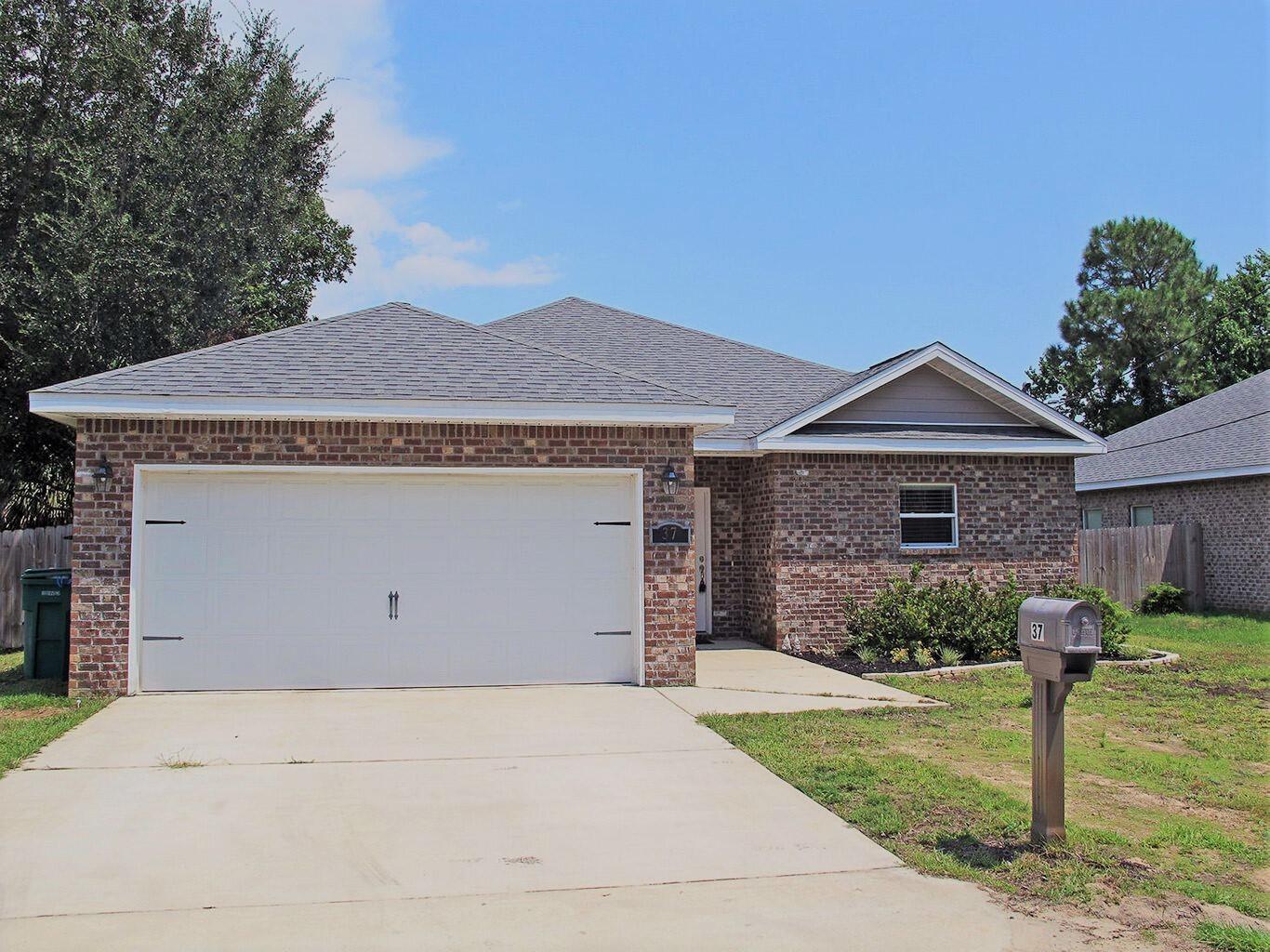 Spacious newer construction outside of Hurlburt Field AFB, and a short drive to beaches, restaurants and more. This well-maintained 3-bedroom 2-bath is the perfect split floor plan for you. Boasting a massive great room that spans your kitchen, living and dining, there is an abundance of space for all your furniture.  
The kitchen features granite counters, pantry, stainless appliances and a breakfast bar with attractive lighting and tons of counter and storage space. Natural light illuminates this home at every turn through the many windows installed. The large master bedroom, offers space for king sized furniture or  sitting area. The master bath host his and her vanity, with perfectly selected granite to match the guest bath. Good size backyard for your storage/entertainment needs.