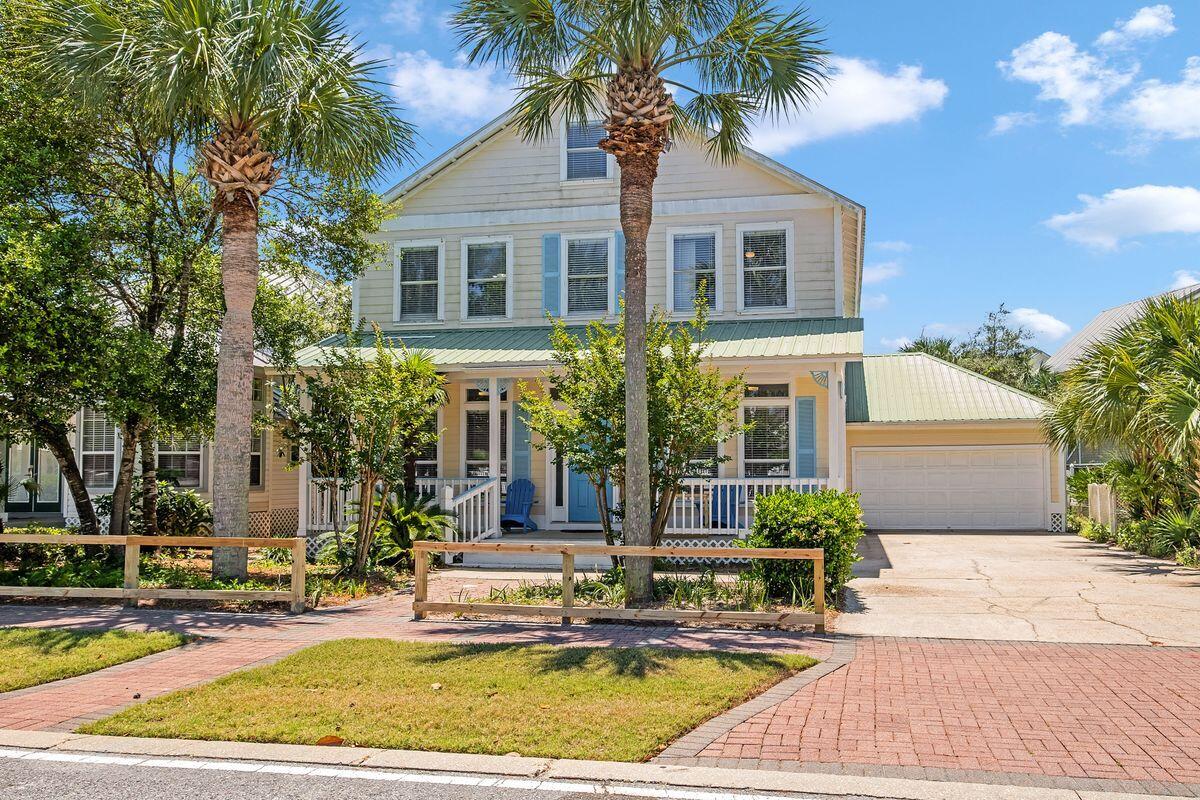 Just 500 yards from the white sandy beach and gulf waters, this quintessential Florida cottage is newly remodeled and surprisingly spacious. Set behind a white picket fence in the heart of Crystal Beach, the brick paver sidewalk leads right to the front porch, two-car garage and generous driveway for parking. Inside, the open floor plan provides a light bright space beneath a white coffered ceiling. There's ample space to put your feet up in front of the new fireplace in the sitting area or entertain in the chandeliered dining area. Cooks will love the well-planned eat-in kitchen with its attractive marine blue cabinetry and central breakfast table. Perch on high stools at the breakfast bar and enjoy cocktails while chatting with the cook. The coastal theme continues into the TV den with shiplap walls, updated coastal decor and comfy furnishings. There is wood and tile flooring throughout. Recent updates include new kitchen countertops and appliances, TVs in all bedrooms, indoor paint and more. Enjoy an indoor-outdoor lifestyle on the multiple balconies and spacious covered deck with lounge furnishings. There's ample space for hosting family and friends with six bedrooms and five full baths, including a large bunk room in the third-floor loft. The airy master bedroom boasts a modern master bath with whirlpool tub, twin vanity and walk-in shower. It's the perfect haven to start and end each fun-filled day. Sold fully furnished, this is the ideal family beach house or investment property with gross annual rental income potential exceeding $160,000+. Pavers surround the oval pool providing a private space for barbecues, relaxing in the sun and cooling off with a dip. Just down the street is a community pool for meeting new friends and neighbors. A two-minute walk or bike ride away is the public beach access and the chance to ride bike trails along Scenic 98. You can be at the supermarket, Destin Commons, the water park, theater, marina and golf courses in minutes from this sought-after beach community.