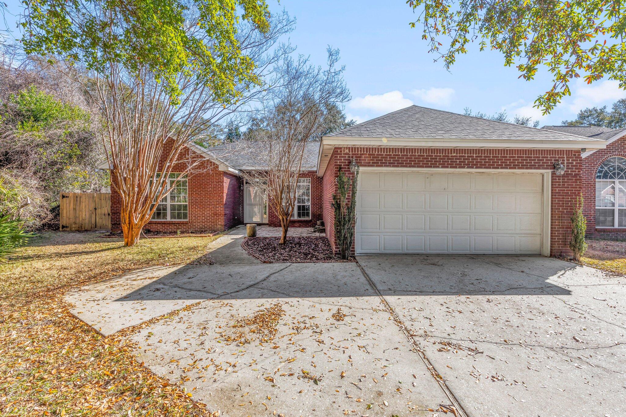 Looking for a one story home with a gunite pool? This all brick home, split bedroom floor plan is situated on a large lot and tucked away in a great location with all the amenities of Bluewater Bay living. The spacious living room features  cathedral ceilings, a gas fireplace, Brazilian cherry wood floors and french doors leading to the screened porch.  The eat-in kitchen was updated last year with granite countertops, stainless appliances and a farmhouse sink. The master bath has a separate shower and walk-in closet.  Roof is 2018, HWH 2016, and HVAC, 2011.  New carpet being installed in rear bedroom this week. The backyard is quite large, fully fenced and has a beautiful  in-ground pool that was completely resurfaced in December 2022. Termite contract with Bryan Pest Control in place.
