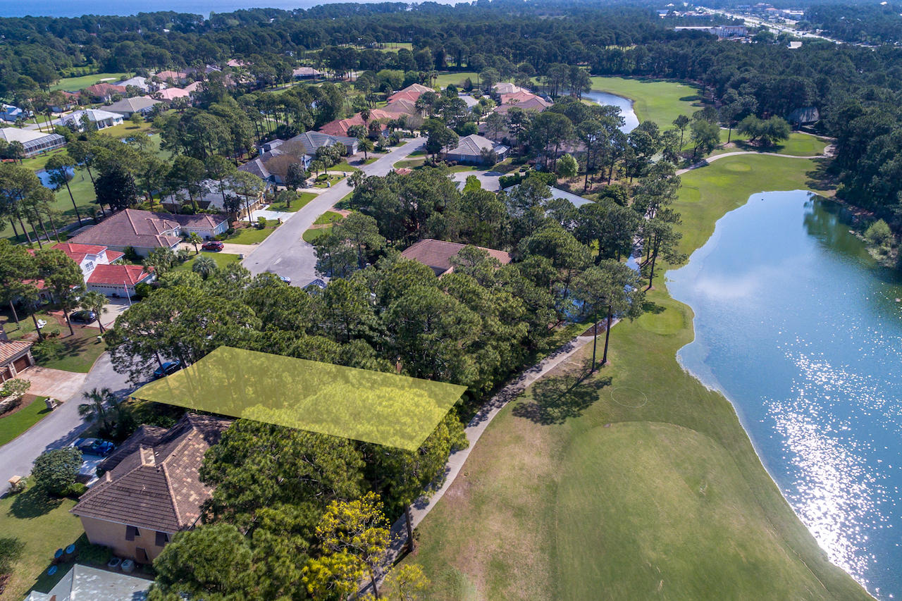 This great residential lot is located on the 7th Fairway of the golf course and the lake in Emerald Bay. This lot has over 130 Feet Of depth, could easily accomodate a swimming pool. It is very private with plenty of trees. Emerald Bay Is A Gated Community With A Championship 18 Hole Golf Course,Tennis Center and courts as well as a Community Pool.