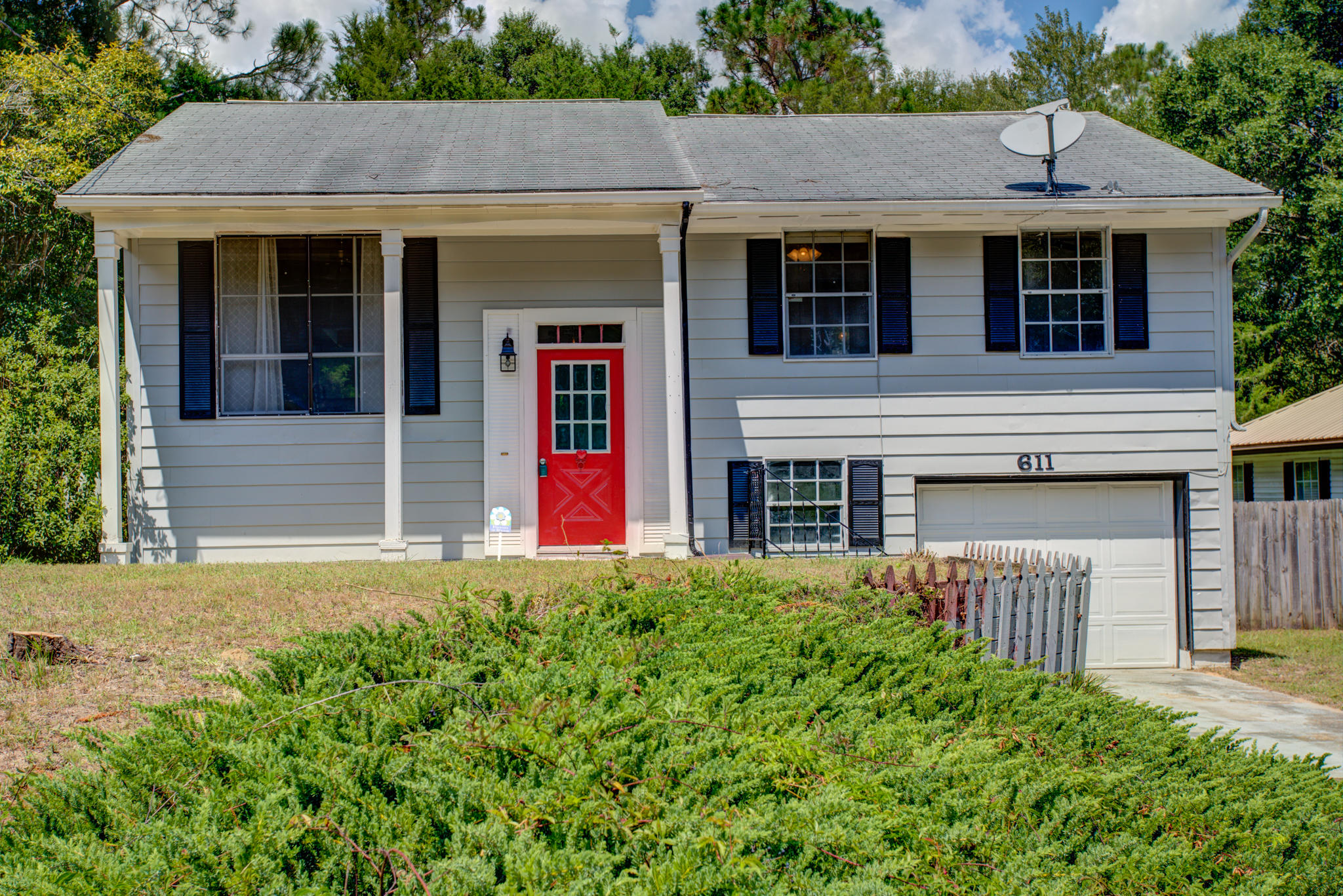 Endless possibilities for this newly renovated split level house. You'll be greeted with warmth as you walk up the stairs into the 1st level with beautiful hard wood flooring, upgrade kitchen, 3 bedrooms and 1 bath. Walk downstairs to an oversized 11x24 bedroom and full-size bath that would be perfect for a mother-in-law suite, an oversized man cave or a game room for the kids. The one car garage is large with plenty of space and equipped with a workspace! Enjoy the sun on top of the spacious back patio that overlooks the perfectly manicured lawn, or step out below to the covered patio perfect for mingling friends or a family BBQ. Seller is offering owner financing with 25% down. Buyer to verify all measurements and information.