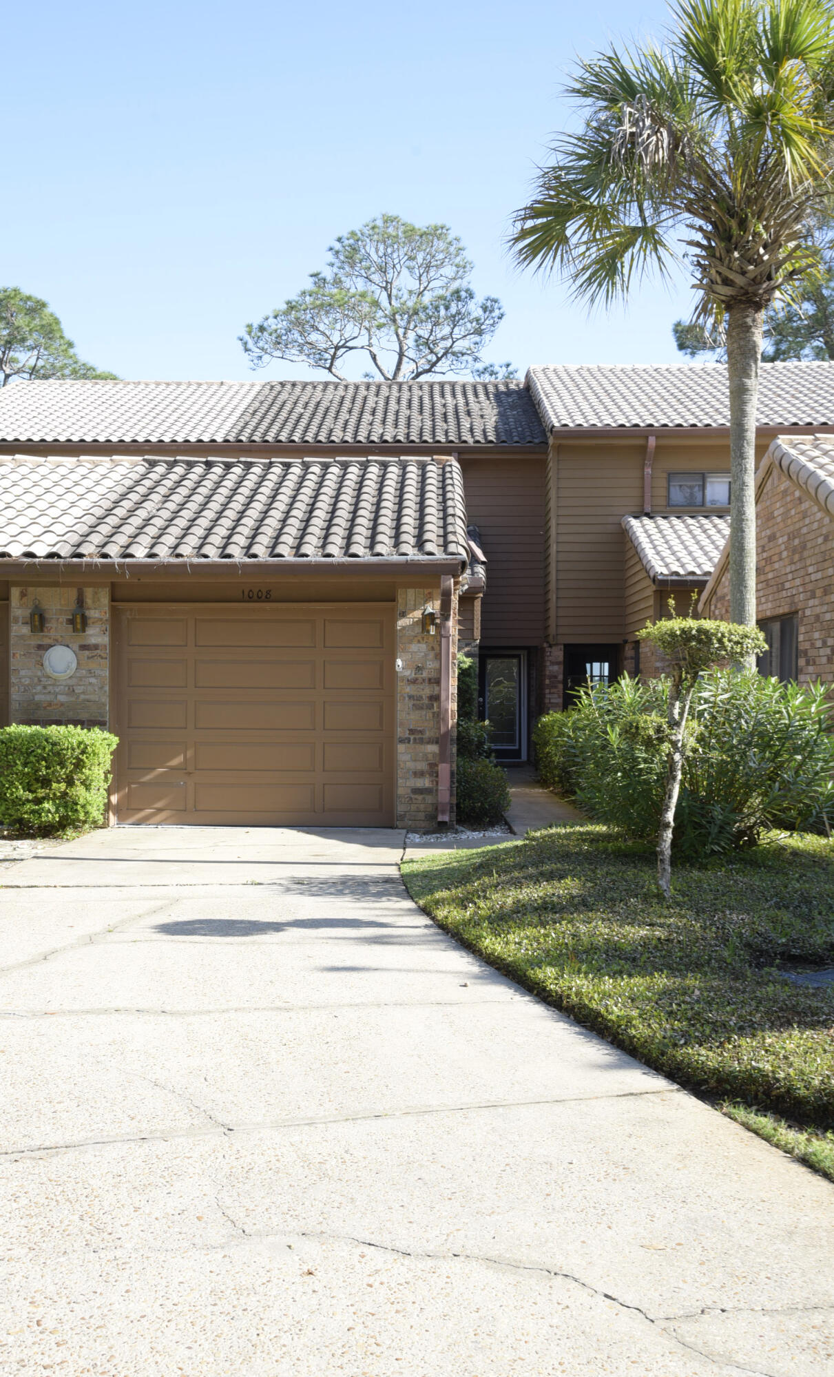 MILLION DOLLAR VIEWS OF BAYOU! This 3/3 townhome is in pristine condition! From the moment you walk through the leaded glass door you will be swept away by quality of this waterfront unit. Neutral colors throughout to suite any decor. Kitchen features stainless appliances (ice maker not warranted) and granite countertops. Main living area has gas fireplace flanked by beautiful built in's. Off the living area is the tiled Florida room with spectacular views of the Bayou. Outside you can enjoy the shared dock with your own boat lift and watching the dolphins play. One bedroom is on the main floor with two other spacious bedrooms upstairs. One bedroom features stunning views of the bayou. Unit even has a washer/dryer (not warranted). A single car garage finishes us this great unit.  Owner will consider a SMALL dog or cat but restrictions apply. Any pet must be spayed/neutered, housebroken and current on all shots. Water Oaks amenities include tennis court and a sparkling pool. Any person 18 years old or older must apply separately. Tenants required to carry renter's liability insurance.