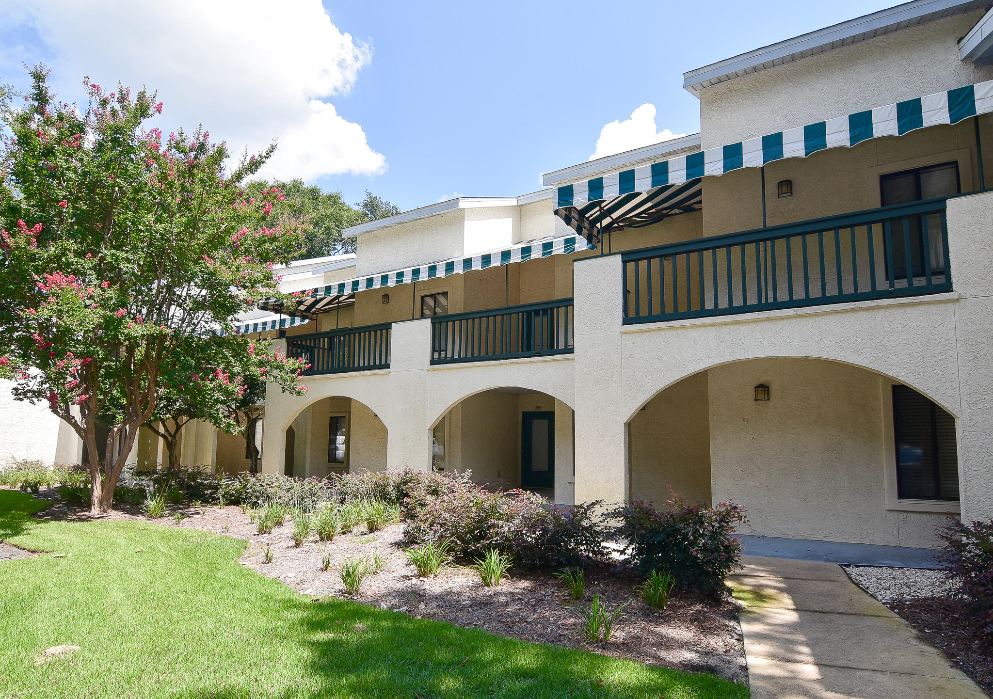 A MUST SEE! Motivated sellers are offering this fully renovated, move-in ready Lakeside condo at Bluewater Bay has access to the lifestyle amenities including 12 professional tennis courts, a  PGA golf course, swimming pools and access to the Bluewater Marina. Upon entry, you will find a single bedroom with access to the guest bathroom nicely stated with a subway tiled shower, white vanity and Kohler fixtures.  Luxury Laminate flooring compliments the modern stylish kitchen with stainless steel appliances and seamless Italian Carrera Marble. The kitchen flows through to the living room and private rear balcony. Upstairs are two more bedrooms including the master bedroom  complete with it's own ensuite updated master bath and private balcony. HOA is replacing awnings on all buildings soon.