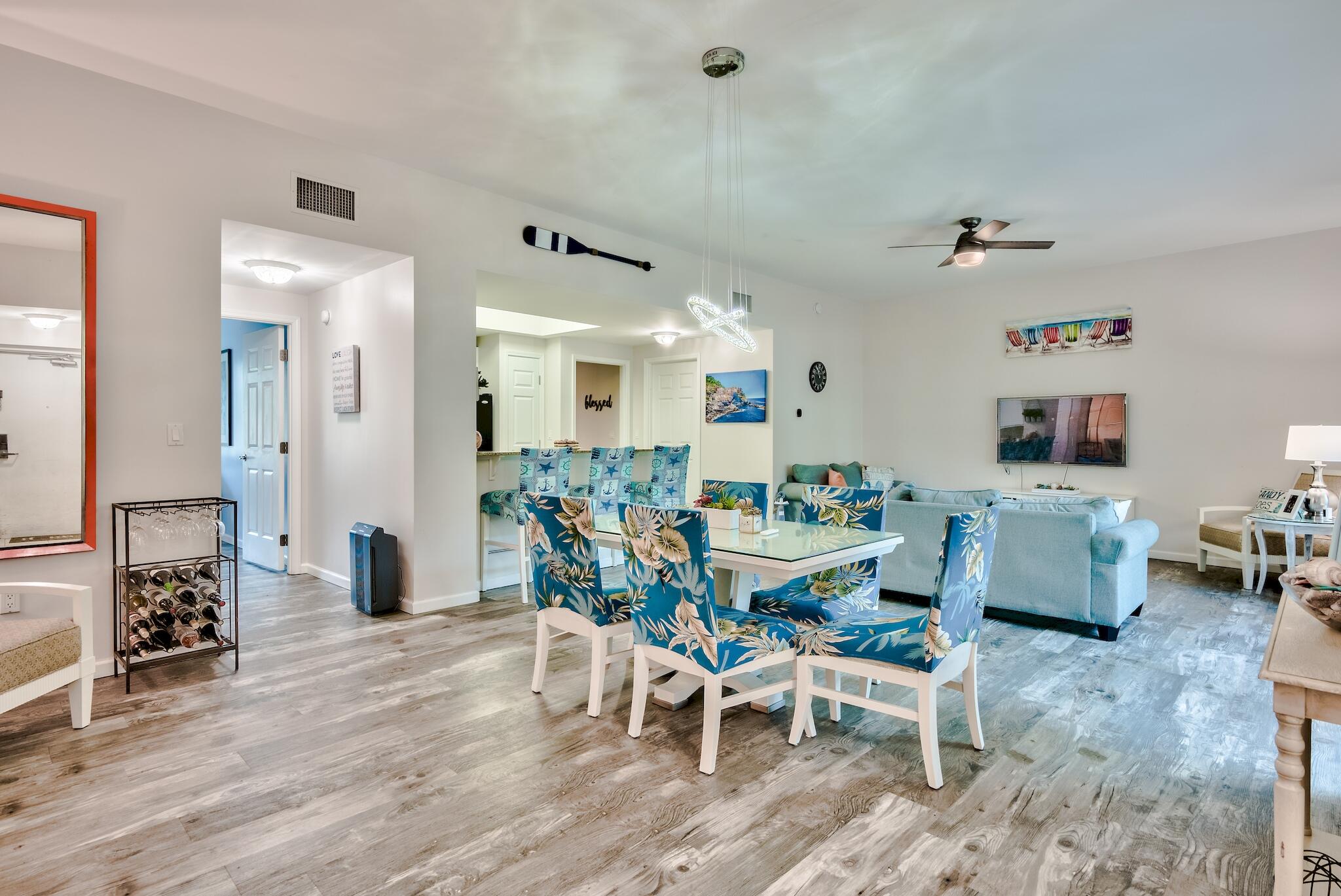 Beautiful 2BR/2BA poolside villa with an open floor plan, new LVP flooring, spacious living/dining combo, breakfast bar, granite counter tops in kitchen & master BA, extra large master BDR, guest BA, large tiled shower, white kitchen cabinets, new dining light fixture, ceiling fans & nice front porch.  This amazing resort is offering a 11,000 sq. ft.  lagoon pool, heated second pool, hot tub, on site dining at the Palms Bistro, Coffee house, Good Vibes Bar, entertainment & pool side food & service in season, Tennis, Pickleball, Basketball, Playground, Large Gym & free Shuttle service in season, Bellhop & Valet service in season.  All utilities are included.  Fully furnished as seen except sofa in master & fridge in laundry.  Over 16K in reservations for June & July. Taking back up offers!