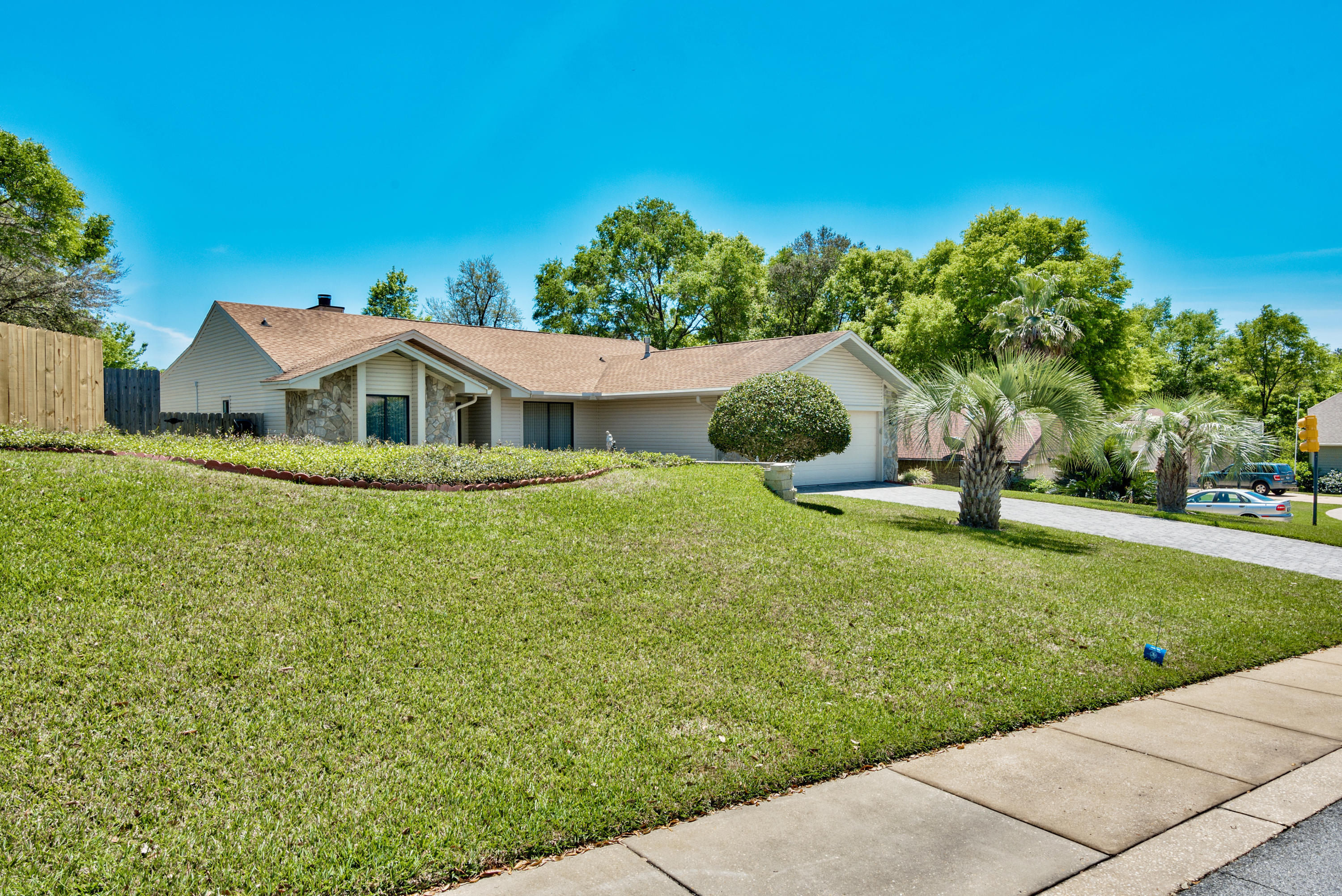 REDUCED $30,000. SPACIOUS,AFFORDABLE HOME W/POOL IN ROCKYWOOD! This home's large great room w/tall ceilings, fireplace & 1 yr old bleached gray laminate floors makes an immediate impact. An additional family room area & sunroom flow effortlessly off the great room and provide room for an office or playroom. The kitchen, w/solid surface counters, offers two pantries, an eating bar & casual dining area and is just steps away from the formal dining room. Offering a slit floor plan, a large walk-in closet & master bath w/shower adjoins the GIANT 336 SF master bedroom w/pool views. Other features include a 2nd large BR w/walk-in closet,laundry room & 8 yr old pool liner, The beautiful backyard w/pool, provides privacy & allows you to enjoy the Fl. lifestyle. Located READ MO in Rockywood, this wonderful home is close to schools, shopping & restaurants.  Come see this fantastic home today!