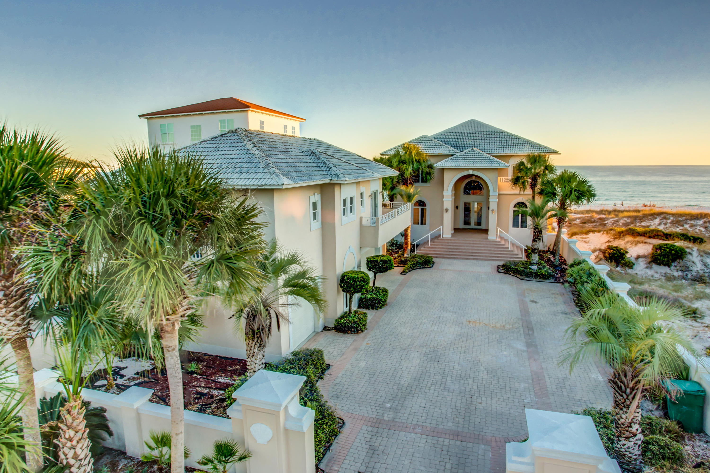 PRICE JUST REDUCED FOR RAPID SALE!! Savor the seaside with 67' directly on one of the most beautiful beaches in America! This beautiful home in a fabulous Crystal Beach neighborhood enjoys incredible views, expansive decks, and your own pool overlooking the Gulf of Mexico! The first floor of the main house features a large, open kitchen, dining, and living area, which is ideal for entertaining, plus 2 bedroom suites. The entire second floor is a luxurious master suite with bedroom on the water, palatial bath, huge closet, living area with wetbar, loft/office area, and large deck. It is easily reached by the attractive curving staircase or via elevator! The carriage house features another living area and bedroom suite, over the 3-car garage. Your private walkover gets you directly to the shoreline for swimming, walking, or toasting the sunset. This home is within walking distance of some great restaurants and a very short drive to great shopping, entertainment, and more!