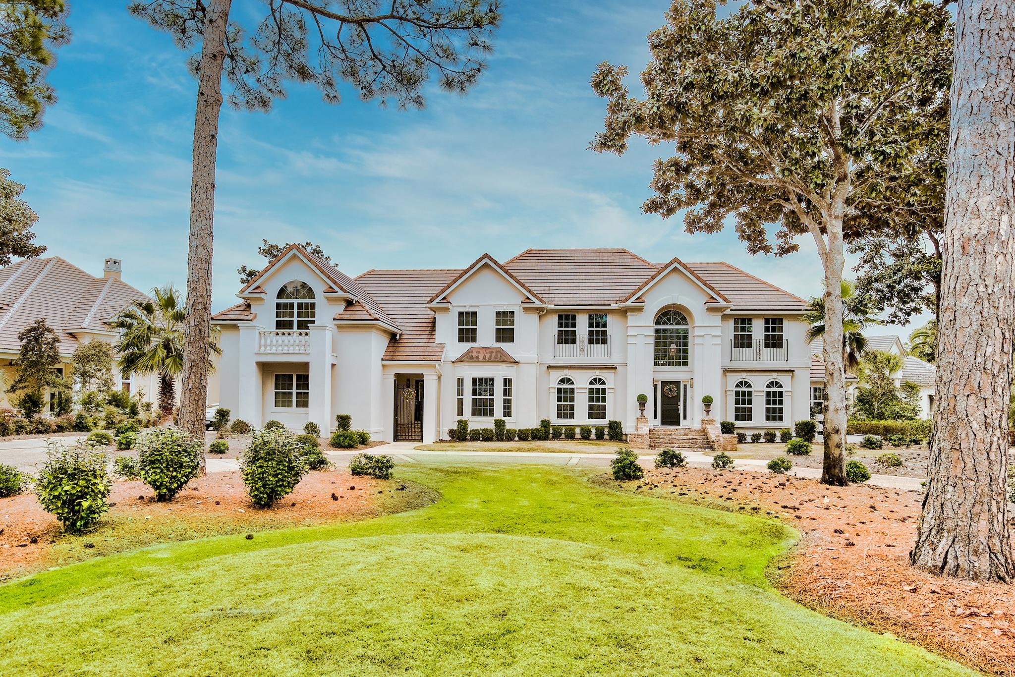 Featuring expansive views across the Burnt Pine Golf Course and the lake, this fully renovated and redesigned Burnt Pine executive home provides its owners with the utmost in comfort and design.  From the moment that you walk through the front door, you immediately realize that you have entered a special home.  Crisp white walls with beautiful, custom woodwork are in perfect harmony with the ebonized wood floors giving the home a contemporary flair while remaining true to the home's traditional design.  This entertainer's dream home has formal living and formal dining areas that flow into an open family room with soaring 20' ceilings.  As you continue to the outdoor living area, you can enjoy the new heated pool and hot tub or enjoy the peace and tranquillity of your own private dock. No detail is overlooked in this renovated residence!  The unique location of this home on a large corner lot provides the owners with gorgeous grounds and lush landscaping.  Recent additional landscaping enhances the park-like setting of this residence.

The kitchen features new cabinets, new counter tops, Thermador appliances, a breakfast area, and views across the backyard entertaining area to the lake and Burnt Pine Golf course.   

The spacious and private Master Bedroom suite has a vaulted ceiling and is conveniently located on the first floor adjacent to the office.  The recently renovated Master Bathroom is highlighted by black marble floors and contrasting carrara marble countertops.  A separate glass enclosed shower and freestanding tub complete the spa-like feel of the Master Bathroom.

Floor to ceiling windows allow the living areas to be bathed in light while capturing those beautiful views of the backyard oasis, the Burnt Pine Golf Course, and the private dock on the lake.  

Upstairs, three spacious bedrooms are available for your family or guests.  All bathrooms have carrara marble countertops, marble shower surround, and marble tile floors.

A coveted, large, state-of-the-art theater rounds out the home and give the owners and their guests the luxury of being entertained while remaining at home. 

Modern, up-to-date fixtures and hardware complete the design of the home.

Call today to schedule your private appointment to view this Sandestin home.