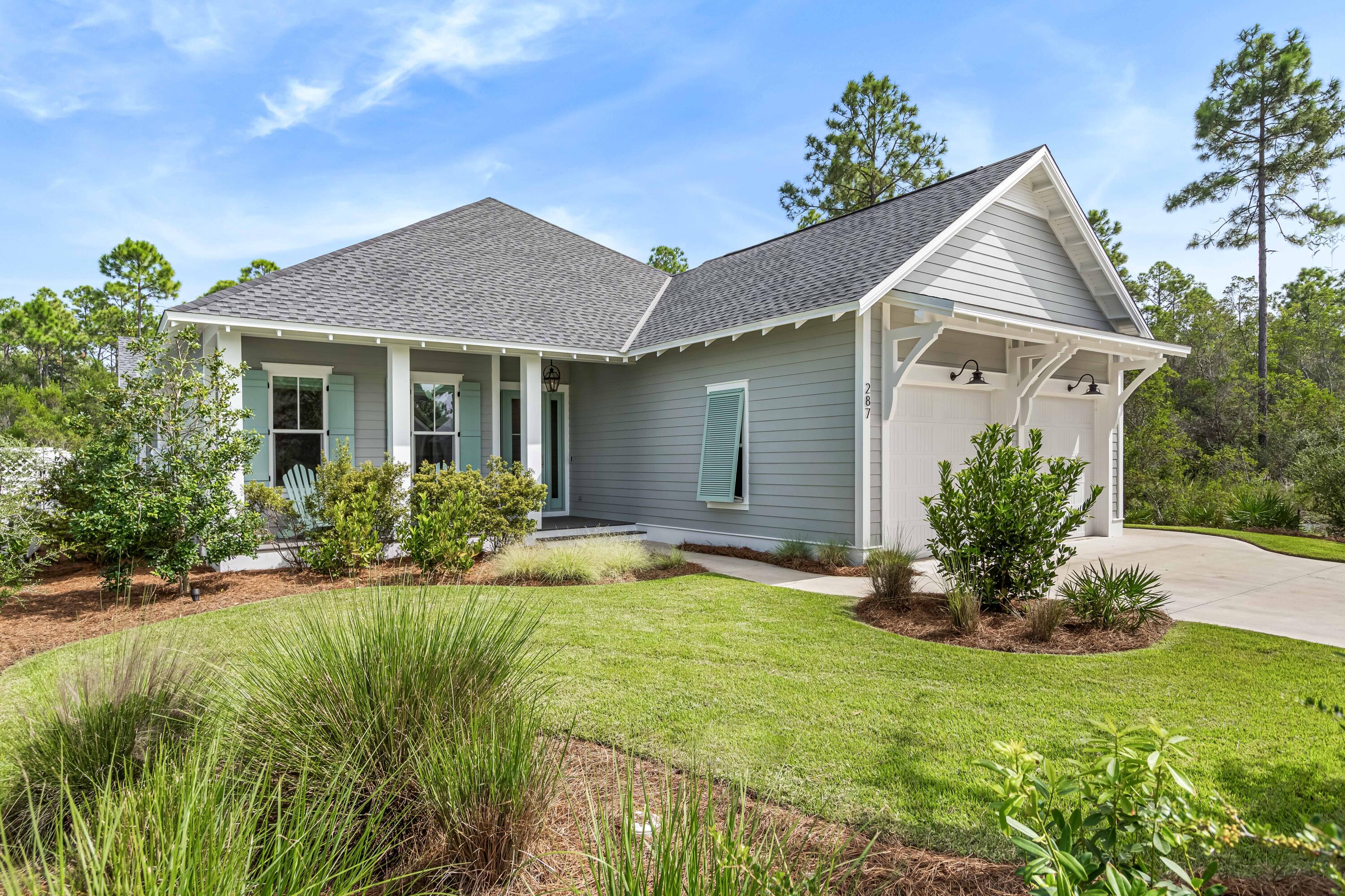 Nestled within the master planned community of WaterSound Origins, this quintessential coastal residence constructed by the distinguished Huff Home building team offers the epitome of luxury coastal living. The sought-after Ficus floorplan showcases an open living concept with over 2,500 square feet of thoughtfully designed living space all on one single level with four bedrooms and a two-car garage. The like-new condition coupled with the tasteful upgrades and furnishing package creates a truly unique and turn-key opportunity. Upon initial approach, the welcoming front porch bordered by lush vegetation leads the way to the entry foyer adorned with shiplap accents. The Chef's kitchen encompasses custom soft-close cabinetry, an oversized island, a professional Wolf and Sub-Zero appliance package, and quartz surfaces. The expansive living and dining areas are perfectly positioned off of the kitchen with direct access to the screened porch blurring the line between indoors and out while creating a true continuation of living and entertaining space. Synonymous with relaxation, the backyard features a grilling pad and custom gas fire pit with seating abutting to a wooded area providing the upmost privacy and tranquility.

The Kingsley wood flooring is carried into the main suite which overlooks the backyard and boasts a sumptuous ensuite with walk-in wardrobe, dual vanities, tiled shower, soaking tub, and private water closet. The additional three bedrooms incorporate ample natural light, storage, and nicely appointed ensuites.

WaterSound Origins provides residents with an impressive collection of amenities including the Villiage Commons pools and fitness center, tennis courts, pickleball courts, miles of nature trails, Lake Powell access, and the opportunity to join the famed WaterSound Club which offers an even larger array of exclusive amenities. Origins is also geographically poised minutes from the white sugar sand beaches and all of the world-class dining and shopping venues 30A has to offer. The WaterSound Town Center located in the front of the community is home to Publix, weekly Farmers Markets, and additional shopping and dining options. Inquire today to schedule a private viewing and start living the coastal lifestyle you deserve.