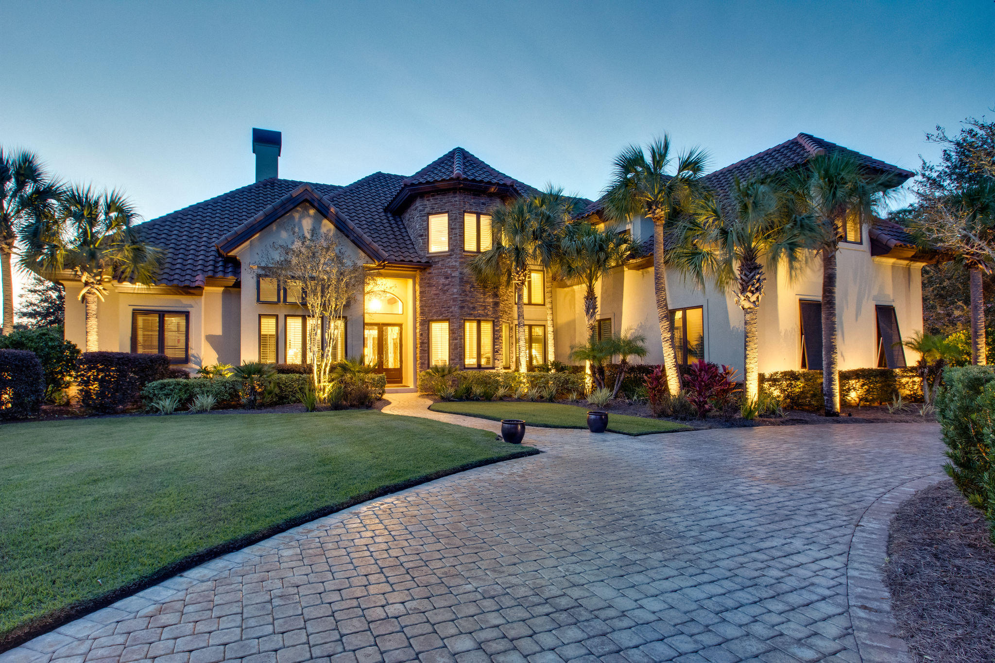 Spectacular Lakefront location in Arrowhead at Burnt Pine, with sweeping Golf Course Views, New to the market and never before offered to the public, this sophisticated, classic, timeless design is sure to please. Custom built, unique and impressive main residence. A separate guest house is also located on the main level featuring a kitchenette, bedroom, bath, laundry, and its own entrance. Ideal floor plan with spacious, plush private master suite, and comfortable living and dining spaces anchored around the kitchen, offering natural light and breathtaking views from every angle. Additional family members & guests will treasure the attention to detail in this truly special property, as the upstairs features unparalled privacy and amenities with two additional bedrooms, spacious living area/multipurpose room, wetbar, and separate laundry. Plenty of relaxing Outdoor living areas on the main level also featuring salt water pool, hot tub, screened lanai, and summer kitchen. Additional Upstairs balcony with built in bar seating truly take advantage of the tranquil views of this superior location.  One of a kind offering, a must see!