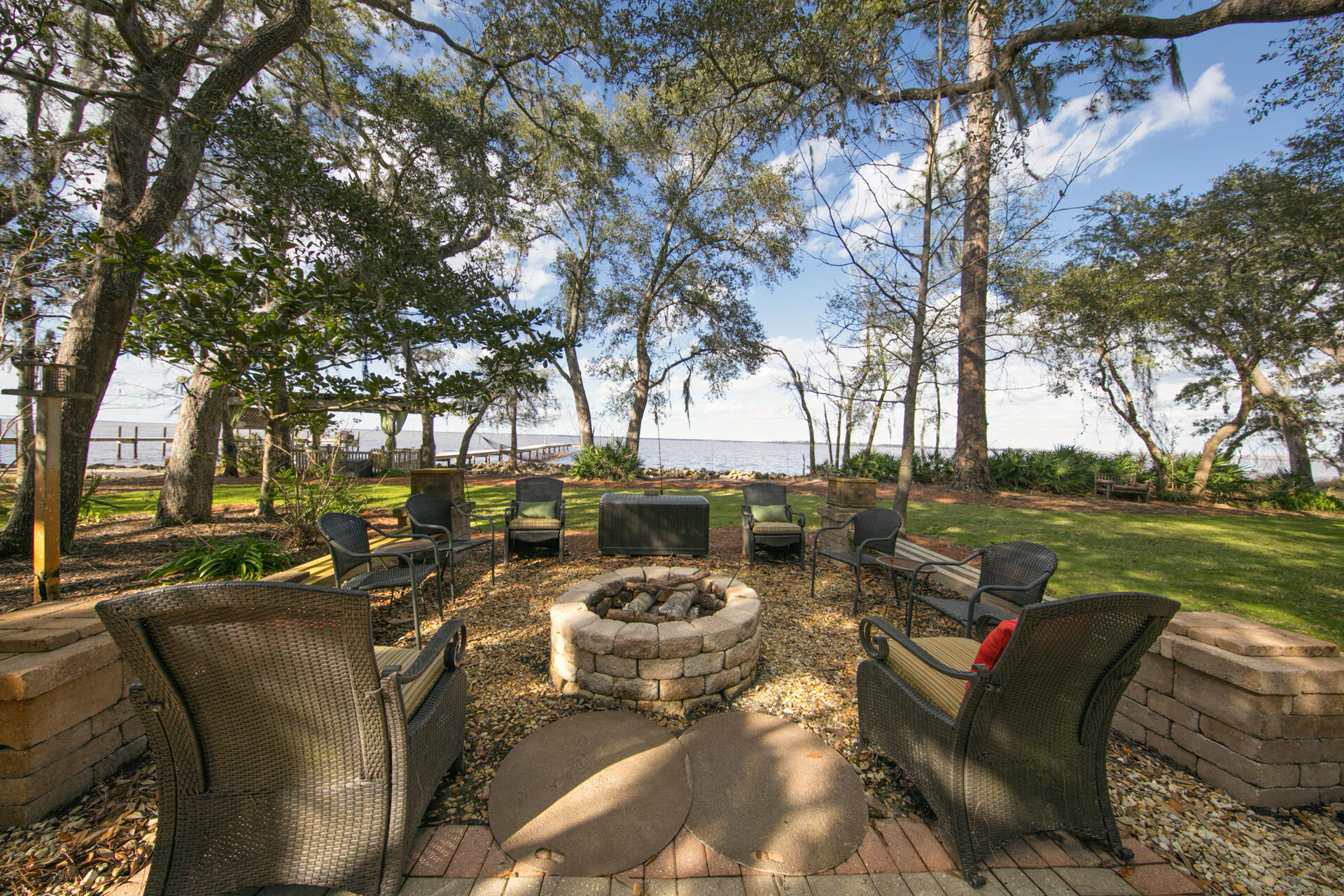 Bayfront estate with dock!  Enjoy this +/-1.25 acre estate sized lot with 230 feet on the Choctawhatchee Bay.  Nestled next to a nature preserve, this property includes a 3,033 square foot main house plus a 1,217 square foot guest house, providing the utmost in privacy and bay views.   This meticulously maintained home provides views from the Living Room, Master Bedroom and Guest Bedroom.  Indoor/outdoor living is easy with the heated and cooled patio. Outdoor spaces include a trellis bar, fire pit and boat dock

Home interiors are well appointed with 12 foot ceilings in the Living Room and Master Bedroom.  The living room features Cypress hardwood floors.

The separate Guest Home contains two bedrooms, two bathrooms and a full kitchen, perfect as a mother-in-law suite.