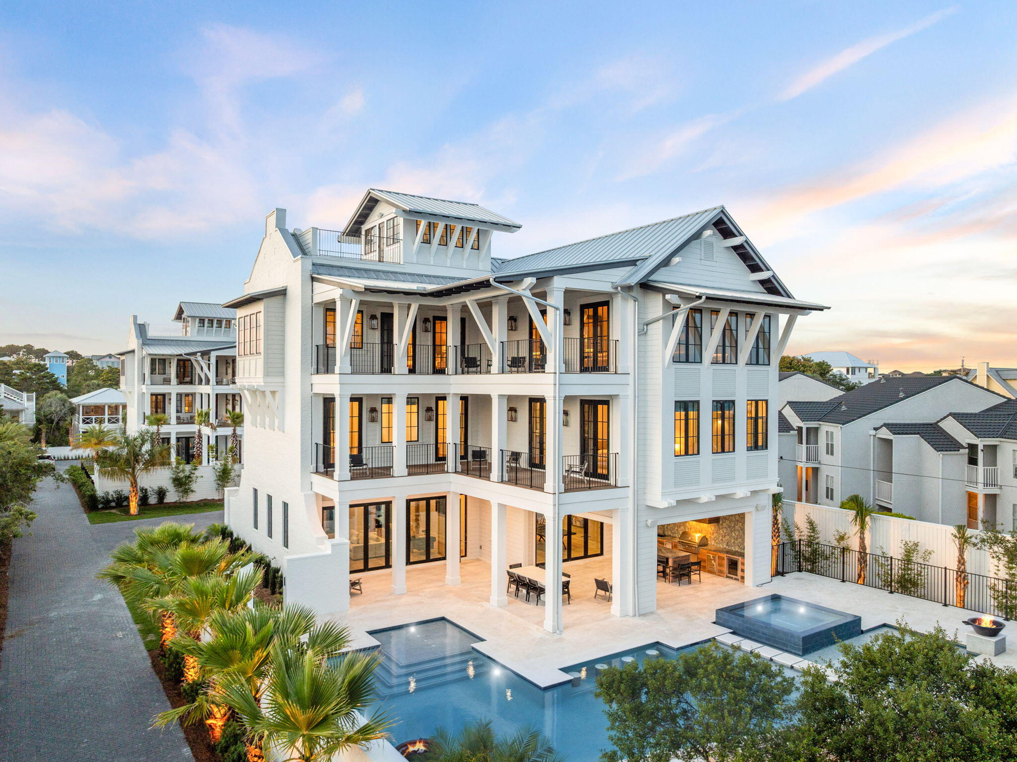 Welcome to ''The Bluffs at Dune Allen Beach'', 5012 W County Hwy 30A is an exquisite new construction home, seamlessly blending the tranquility of beach town living with luxurious modern amenities. This three-level estate offers an idyllic retreat with its private pool, hot tub, and expansive outdoor living spaces totaling over 7076 square feet. As you step into the grand foyer on the first floor, you'll be greeted by a spacious Game Room, perfect for family gatherings and entertaining friends. Adjacent to it, the expansive Living Room invites relaxation with its comfortable seating and serene views. The thoughtfully designed ''Bunk Area'' offers additional sleeping space, making it ideal for children or extra guests.
 Ascending to the second floor, you'll discover a haven of tranquility in the primary bedroom, a sanctuary complete with a spa-like ensuite bathroom and a private balcony that captures stunning sunset vistas. The floor also hosts five elegantly appointed guest bedrooms, each offering privacy and comfort for your guests.

The third floor is an entertainer's dream, featuring another primary bedroom that epitomizes luxury. The gourmet kitchen is a chef's delight, equipped with top-of-the-line appliances, custom cabinetry, and a large island perfect for culinary creations. The adjoining living room, with its vaulted ceilings and panoramic windows, provides a light-filled space for socializing and relaxation. Additionally, the third floor includes versatile attic space, suitable for storage or creative use.

This magnificent residence boasts a total of seven bedrooms, plus the charming bunk area, ensuring ample accommodation for family and guests. The high-end finishes throughout the home include rich hardwood floors, custom millwork, and designer lighting, which enhance the aesthetic appeal and comfort.

The property's outdoor spaces are designed for both relaxation and entertainment. Enjoy the private pool, hot tub, and multiple outdoor seating areas perfect for alfresco dining and lounging. The observation deck offers a panoramic view of the stunning Santa Rosa Beach sunsets, making it a highlight of this luxurious retreat.

Situated in a serene location yet conveniently close to Dune Allen Beach, 5012 W County Hwy 30A provides easy access to a variety of restaurants, shops, and beachside activities. The strategic location near popular local destinations such as Gulfplace, Shunk Gully, and the Santa Rosa Golf and Beach Club ensures a lifestyle of convenience and leisure.