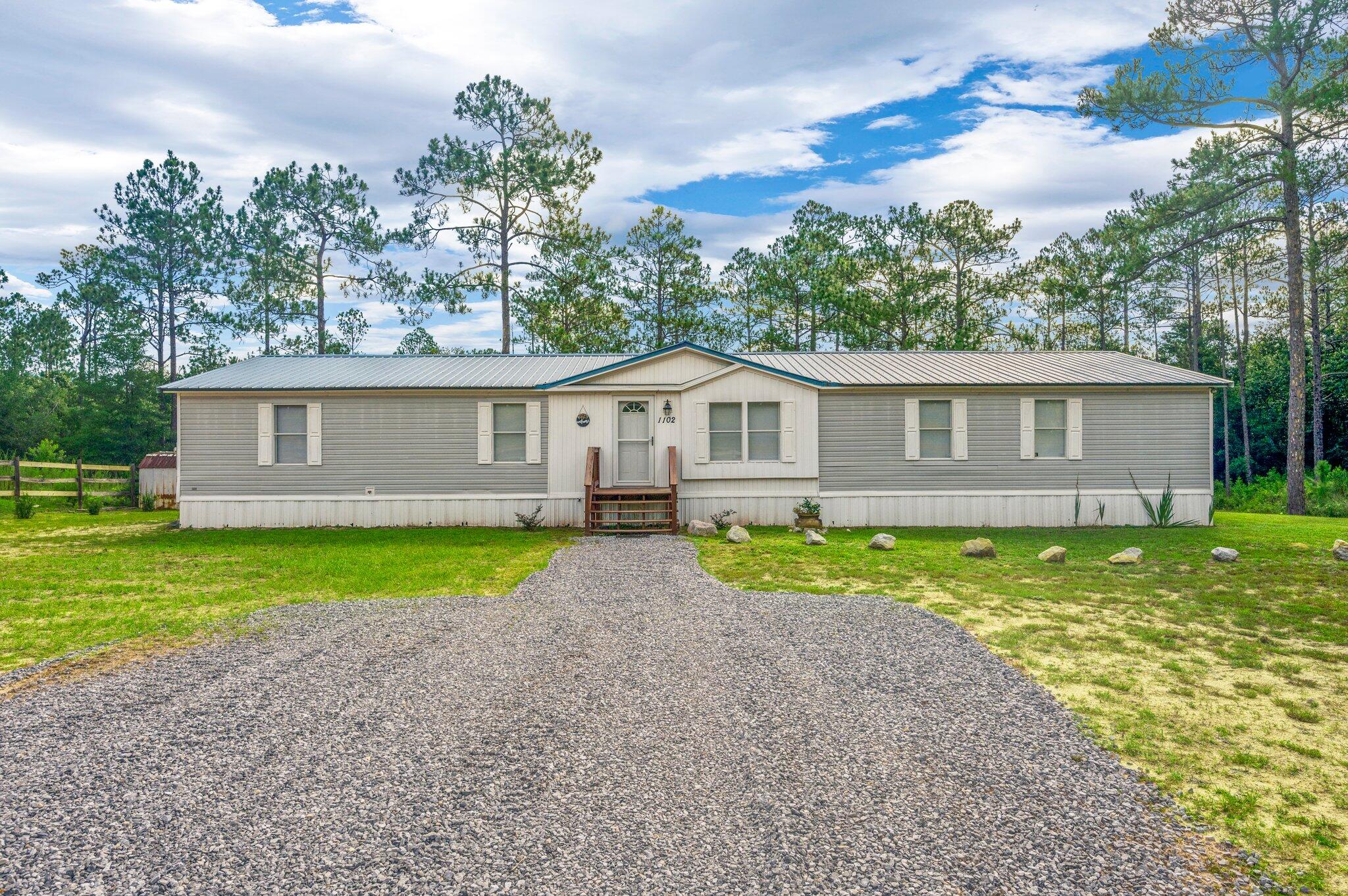 Seller is offering up to $5000 toward buyer closing costs or to buy down the rate! 
Nearly 1.5 acres of peace and quiet! This lovely home is ready for new owners. Five bedrooms and 3 full bathrooms make this a great home for a large family or for someone that wants to have some roommates, but not give up space! 
Large living areas and good sized bedrooms...this home has a lot to offer!  Metal roof, fresh carpet, brand new driveway...
There is a creek running through the property. Flood zone X and the home sits high and dry! Paved road access and a fantastic price!