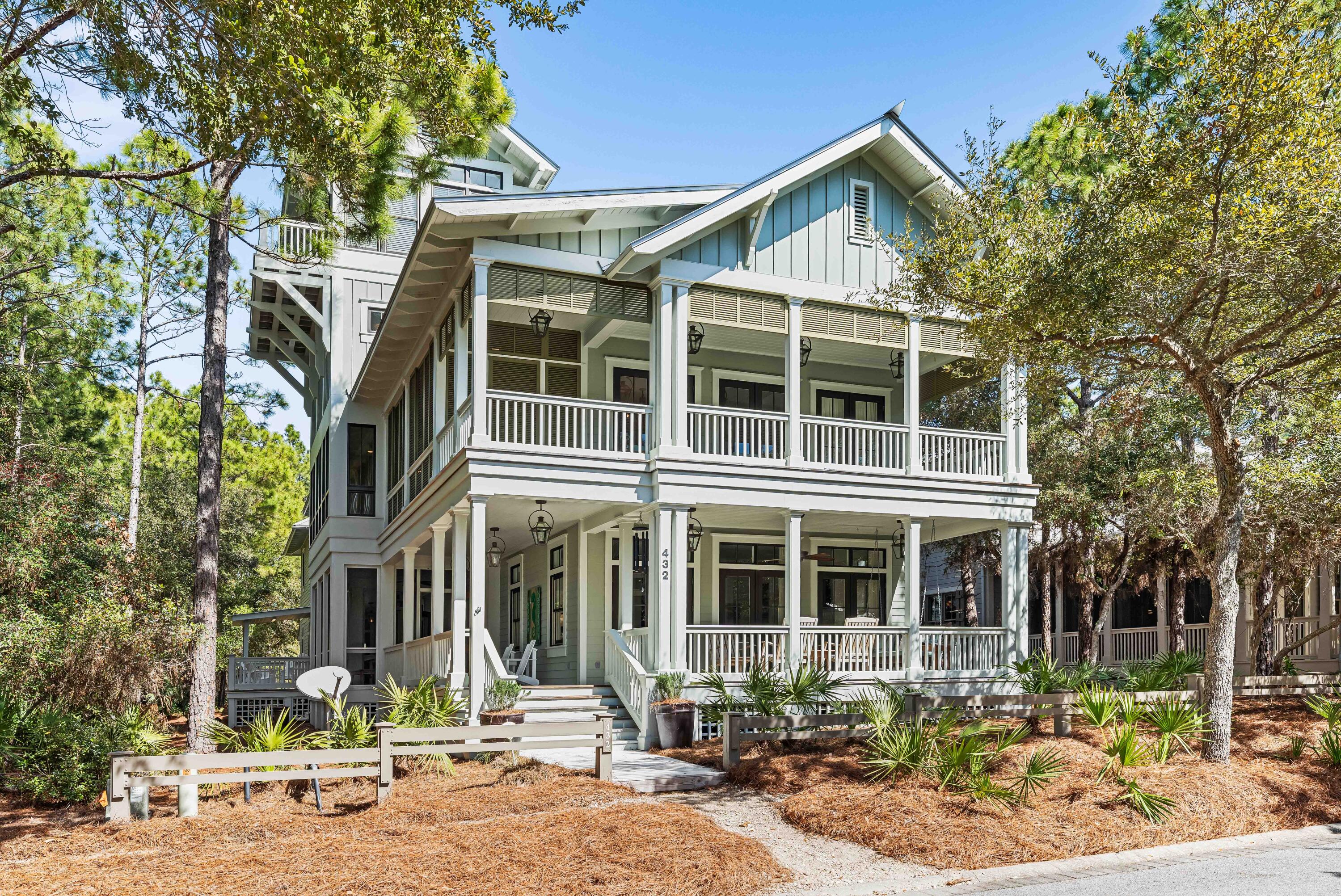 This stunning custom home in WaterColor is a masterful blend of timeless design, superior craftsmanship, and modern luxury. Thoughtfully curated by acclaimed designer Erika Powell of Urban Grace Interiors, with functional architecture by Archiscapes and expert construction by Baywoods Development, this home stands as one of WaterColor's finest. Rich in character, the home features hand-sewn wood flooring reclaimed from an 1800s train station, flowing seamlessly throughout both the main residence and the guest house. Painted tongue-and-groove paneling wraps nearly every room, enhancing the home's warm and inviting coastal aesthetic. Designed for Entertaining & Everyday Living, This property provides enhanced privacy with a beautiful unbuildable parcel on the southwest side. The first floor was crafted with gathering in mind, boasting an open-concept layout that flows effortlessly into a chef's dream kitchen. Equipped with a Sub-Zero refrigerator and freezer, Wolf range, Scullery, and high-end custom wood cabinetry topped with white marble, this space is as functional as it is beautiful. Dual farmhouse sinks serve as a prominent centerpiece. French doors lead to an expansive wraparound porch, screened porch, and outdoor grilling area, creating the perfect setting for indoor-outdoor living. Additional first-floor features include a spacious living area with a brick fireplace, formal dining room, guest bath, office, and laundry area. 
Upstairs, whimsical built-in bunk beds, charming barn doors, and a thoughtfully designed laundry room add character and functionality. The primary suite is a true retreat, featuring a luxurious ensuite bath, expansive porches, and a tranquil sleeping porch. Two additional guest bedrooms with ensuite baths, a cozy den with a wet bar, and a light-filled reading room complete this level.
Unparalleled Views & Bonus Spaces continue up to the third-floor game room, then make your way to the fourth-floor tower room and widow's walk, where you'll enjoy breathtaking 360-degree views of WaterColor.

The detached charming guest house, situated above the two-car garage, offers a full kitchen, living room, private bedroom, and bathroom, making it a perfect private retreat for guests. The large private lot has space for a pool, adding even more potential to this already remarkable property.
This home has been meticulously cared for and is offered furnished, with some exclusions.  A rare opportunity to own a truly exceptional WaterColor residenceschedule your private showing today!