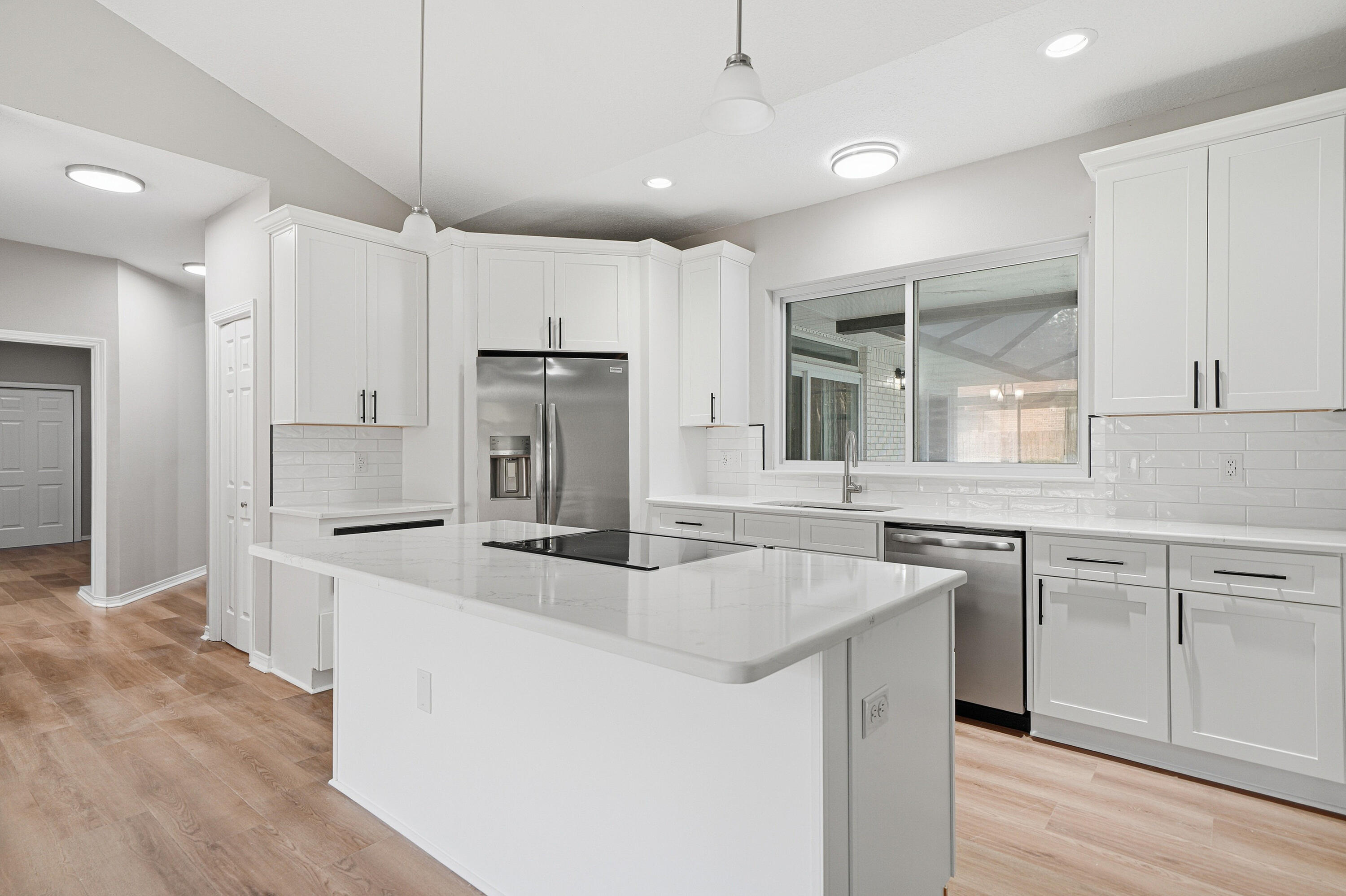 Turnkey Navarre gem with water views! Completely updated and move-in ready, this stunning 3-bedroom, 3-bath, 2-car garage home offers approximately 2,500 sq ft (MOL) in one of Navarre's most prestigious neighborhoods. Every major system has been done -- New roof & AC (2025), New hot water heater, and new paver driveway, so you can buy with confidence. Enclosed pool, a fully remodeled interior with a brand-new kitchen, new flooring throughout, updated fans and lighting, textured ceilings, and beautifully renovated bathrooms (4 years ago). Situated on a great lot directly across from the water, this home delivers style, comfort, and peace of mind in a prime location. Voluntary HOA. Voluntary HOA $75/year. For Member water access.