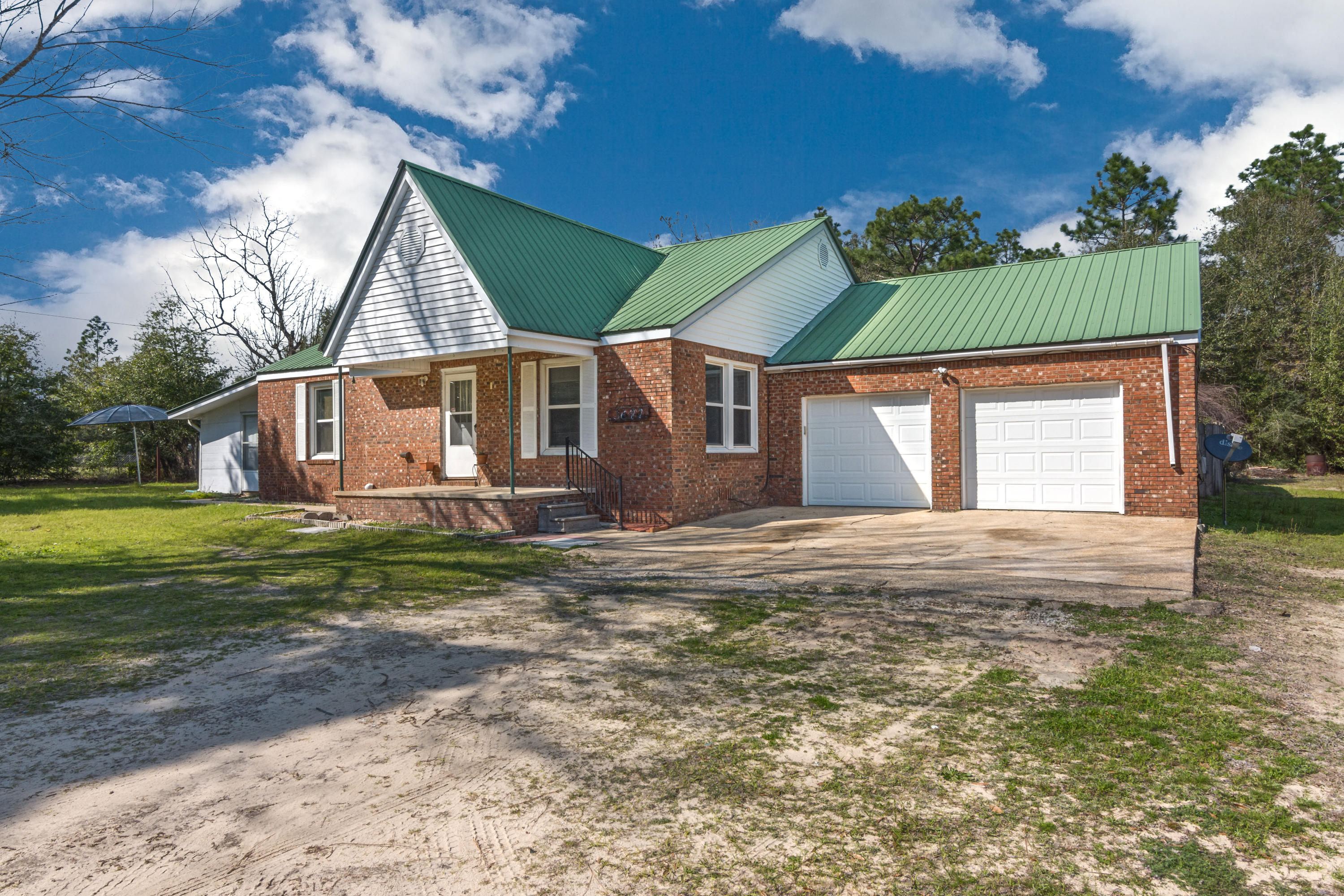 **Also avail. for Lease $1,275/mo with Purchase Option** See Below in ''Addl. Info'' Ranch style home placed on 1 acre. Recent HVAC. What we love about this house is the ''step down'' 12'x36' partially finished Florida Room which is in addition to the 1,600 sf of heated and cooled space, 2-car garage, & massive laundry room off garage. Majority of home is solid hardwood (original); Home is on Septic (2003) and city water; Copper Wiring and double pane windows installed. This home features two den / living room spaces, and an open concept kitchen. Kitchen and bathrooms have not been redone, and are ready for your design influence! No HOA, and plenty of room to park a BOAT or RV. Home is elevated, not on slab, with the garage on slab. Washer/Dryer, and refrigerator included in purcha Lease/Purchase Option details:
Lease Term: 2 yr with option to purchase any time during with no penalty or fee. Lease Price: $1350 / month, non-negotiable.
Down Payment: Minimum $10,500 down payment; this is non-refundable and is NOT a deposit.  Non-negotiable. Purchase Option: In exchange for locking in today's list / purchase price, the $10,500 non-refundable down payment will apply toward the purchase price only if the option to purchase during lease is exercised.