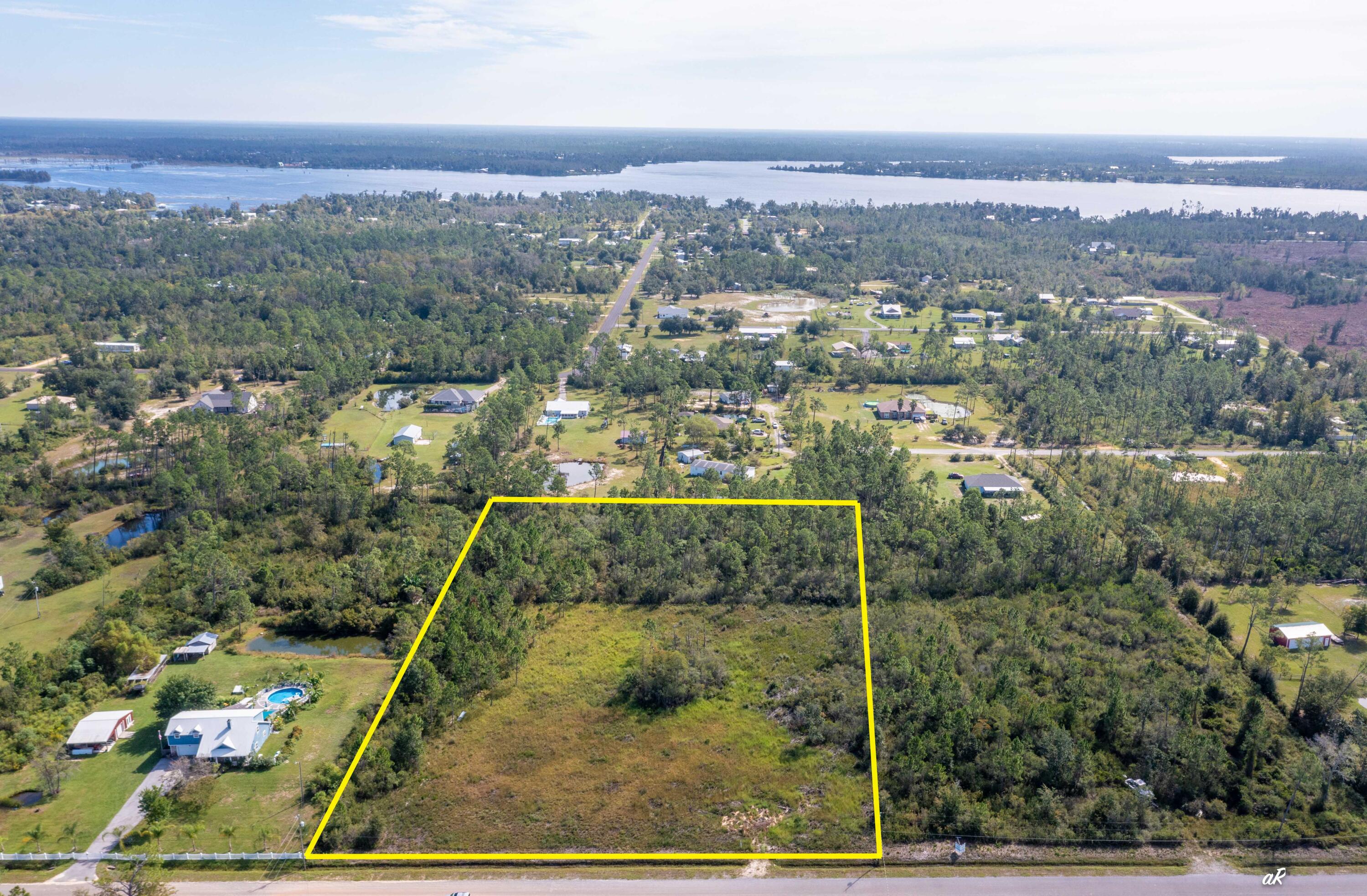 5+/- acre lot located on Holland Road in Southport, Florida - just north of Lynn Haven. Any lot that is larger than 2 acres on Holland Road is a rare find. This lot is perfect for a buyer that is looking to build a large homestead. This lot is close to everything you need, shopping, restaurants, but still has the quiet and quaint feel of country living. There is also a 3 acre parcel south of this parcel for sale.
