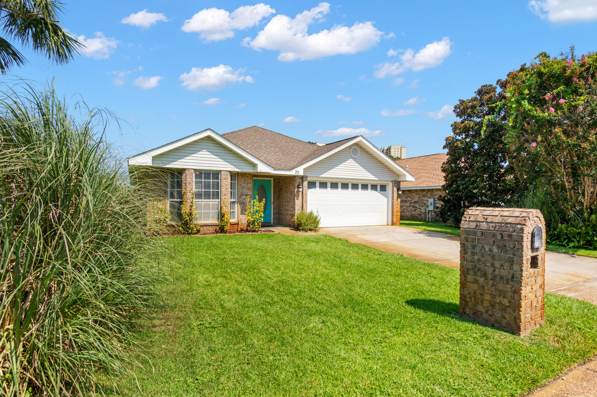 This coastal beach home sits tucked away in the quaint community of Seaspray, a cozy and quiet neighborhood ideally located less than half a mile from the beautiful emerald waters of the Gulf of Mexico.  Presenting an incredible investment opportunity with several years of proven rental history, this home has grossed over $75k year to date in base rental rate, and is offered fully furnished as a turnkey, rental-ready home.  Designed with coastal finishes and decor, this 1-level brick home features a split floor plan, complete with 3 bedrooms and 2 full baths, and a bonus bunk room for additional sleeping arrangements.  The oversized maser suite features a separate garden tub and shower, and a walk-in closet. Outdoor activities abound with a private pool with custom landscaping and entertainment area.  Prominently located along Eastern Scenic 98, enjoy walking, biking, and golf carting to one of the several famous beachside restaurants such as Surf Hut and Whale's Tail, and accessing the beach from the gated, deeded community accesses directly south.  Primely positioned to all of the incredible amenities, dining, and shopping in Destin and Miramar Beach, this home presents a rare opportunity to own in the cozy Seaspray community.