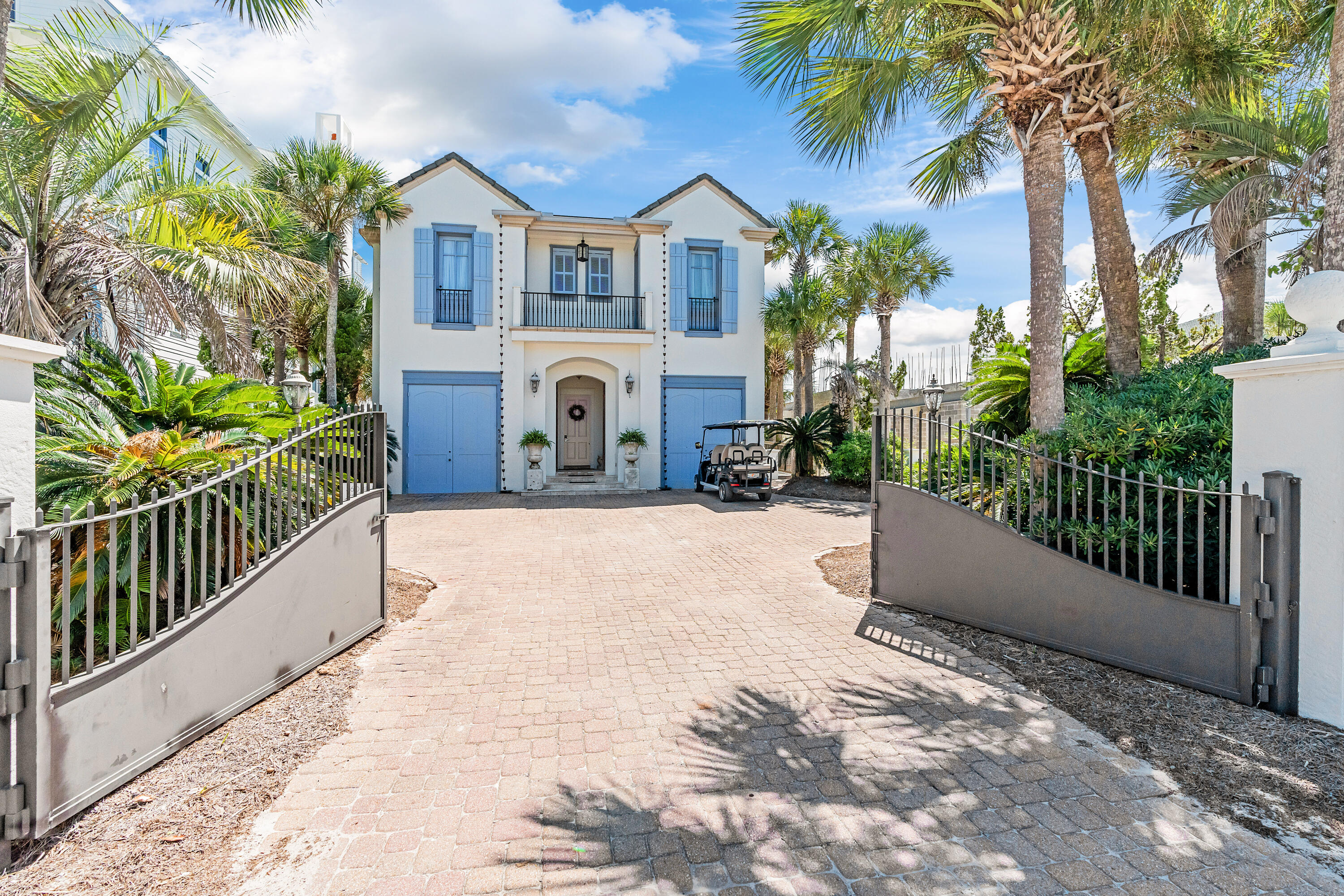 Incredible panoramic views of the Gulf and Eastern Lake... prepare to be swept away by this French Caribbean inspired Gulf Front home designed by acclaimed architect, Tom Christ, and New Orleans Interior Designer, Patrick Dunne. 'Chez Fleur' was notably featured on HGTV's 'Homes Across America.' Timeless and beautiful details intrigue at every turn, from the soft colored textured plaster walls that reflect light at different times of the day to a gorgeous portico entry and circular vestibule leading to a light-filled hall with twin courtyards on either side. The gated entrance ensures privacy; the most charming antique reclaimed hardwood floors and the wood staircase with cast bronze baluster ''wows.''  The first floor offers two guest suites just off the vestibule. Gulf views draw you to the south side of the house where three sets of French doors leading onto a wide porch welcome dining al fresco or soaking up gulf breezes and sunsets. A brand new heated pool and spa can be enjoyed year round! The living room with a large fireplace and generous dining space elegantly span the entire back of the home. Adjacent to the dining area is the French-styled kitchen with Alabama marble countertops. From the kitchen, walk out onto the eastern courtyard for grilling on the natural gas grill. Over on the western courtyard is an outdoor shower and access to the private beach walkover via a newly rebuilt boardwalk. A half bath services the lower level near the laundry. Upstairs are two matching guest suites with private baths, a large bunk room, and a spacious Gulf front master with wood-beamed ceiling, two walk-in closets and a master bath with dual sinks and a multi head shower. Three sets of French doors lead to a private covered porch with incredible panoramic vistas. On the north side of the home, opposite the master suite at the end of a comfy common area, are the two identical spacious guest suites, each with views of the Gulf. A second-floor full bath services the common area and bunkroom. The home offered furnished with a mix of contemporary furniture and imported antiques, including a pastry table from a French chateau. Buyer is responsible for personally verifying details about this property. Any information contained in this listing is believed to be accurate but is not guaranteed.