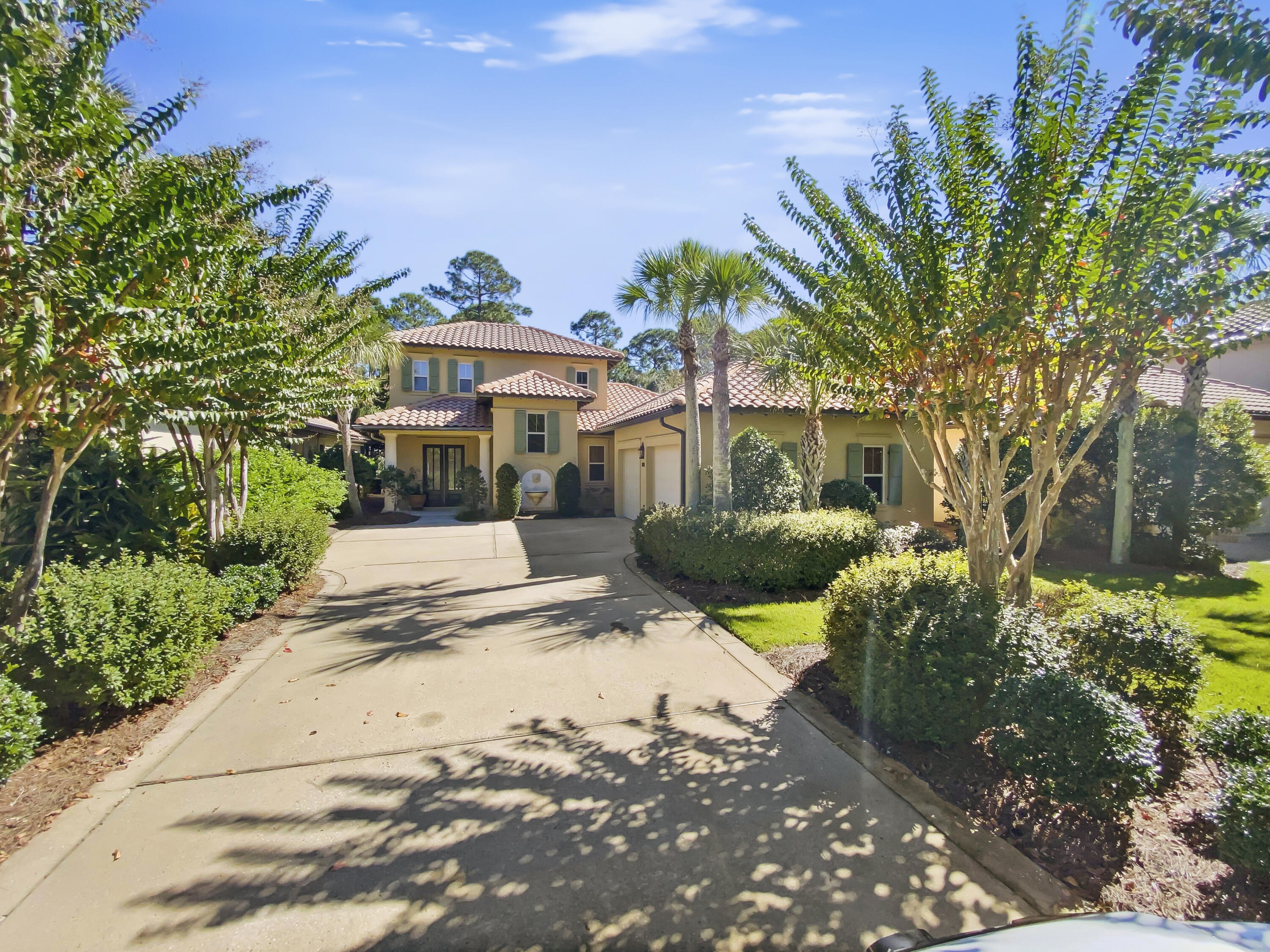 The Vineyards at Raven Oaks is one of the premier neighborhoods in the Sandestin Beach and Golf Resort. This beautiful Mediterranean style home  is perfect for the permanent resident or a great second home. The home has 4 bedrooms and 4 1/2 baths with travertine and wood flooring throughout except in the bedrooms. This open floor plan is great for entertaining or just enjoying a relaxing lifestyle. The saltwater pool and lanai area are accessible from both the living area and the master bedroom. The second bedroom, which can also be used for an office or a library is also on the main level. The second level has the two guest bedrooms with their own private baths plus an additional living area. The exterior was Elastomeric painted in Oct 2015. The upstairs ac unit was replaced in 2016 and the main downstairs unit was replaced in March 2017. All the pool equipment has been replaced as well. The patio furniture, outdoor TV, grill, and 1999 SLK 230 Mercedes convey with the purchase of the property.  HOA is $350.00 a month and the SOA is $405.15 per quarter.