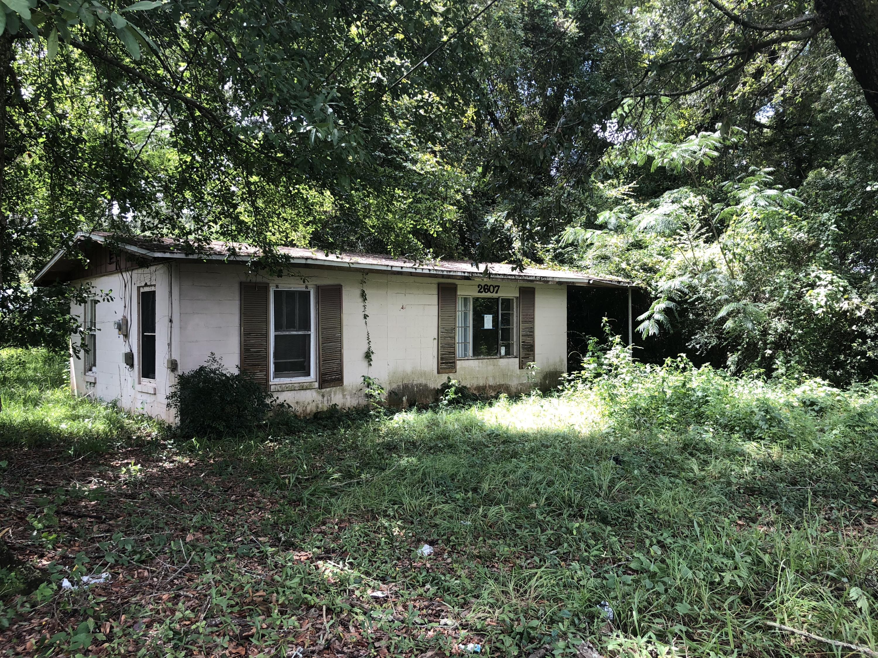 REO. AS-IS. LOOKING FOR A TEAR DOWN OR LAND FOR NEW CONSTRUCTION. LOOK NO FURTHER. CONCRETE BLOCK 640 SQUARE FOOT HOME BUILT IN 1954. LAND VALUE ONLY.