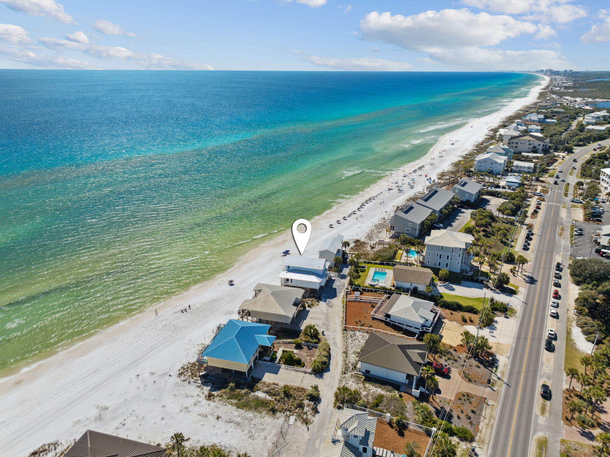 Positioned along a private road on the tranquil West end of 30A, this extraordinary Gulf-front residence captures sweeping, unobstructed views of the emerald waters and sugar-white sands, stretching endlessly in both directions. Thoughtfully renovated in the spring of 2024 and beautifully furnished with a refined coastal aesthetic, the home effortlessly blends classic beach house charm with modern luxury—making it a compelling retreat for personal enjoyment and long-term ownership.

Every element of the home has been curated to complement the surrounding natural beauty while providing a sense of ease and comfort. A soothing coastal color palette and low-maintenance finishes create a relaxed, livable atmosphere, ideal for carefree beachside living. Vaulted ceilings and abundant natural light enhance the spacious interior, which features 4 well-appointed bedrooms, 2.5 baths, and two generous living areasoffering flexibility for entertaining, hosting, or simply unwinding in style.

The open-concept kitchen and dining space is a natural gathering point, thoughtfully designed for both everyday living and elevated entertaining. A sleek wet bar adds a layer of sophistication, perfect for sunset cocktails or weekend celebrations with friends and family.

Step outside to discover multiple outdoor living areas that embrace the serene Gulf-front setting. An expansive covered porch offers a front-row seat to the ever-changing colors of the sea and skyideal for morning coffee, quiet afternoons, or golden-hour gatherings. A dune-side covered deck brings you even closer to the shoreline, where the rhythmic sound of the surf creates a calming, meditative ambiance.

Offered fully furnished, 103 Fort Panic presents a rare, turnkey opportunity for those seeking a beautifully updated coastal sanctuary in one of the most coveted and peaceful stretches of Scenic Highway 30A.