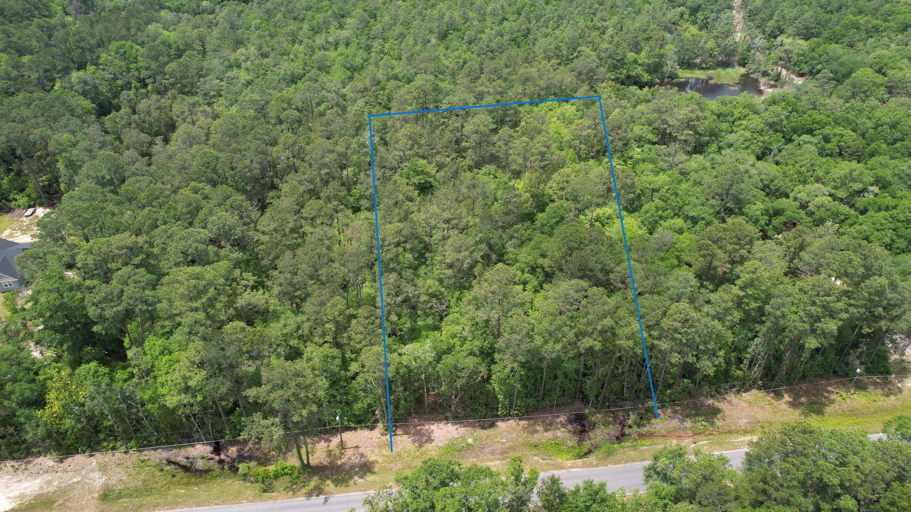 Embrace the peacefulness of nature on this 2-acre wooded retreat, offering the perfect canvas for your dream home. Surrounded by towering trees and lush foliage, this picturesque parcel provides privacy and seclusion. Imagine waking up to the soothing sounds of birds singing, turkeys gobbling and the gentle rustle of leaves, as sunlight filters through the treetops above. With ample space for your ideal residence and room to roam amidst nature's beauty, this wooded oasis invites you to create your own sanctuary. Seize the opportunity to build your dream home amidst the serenity of the forest.