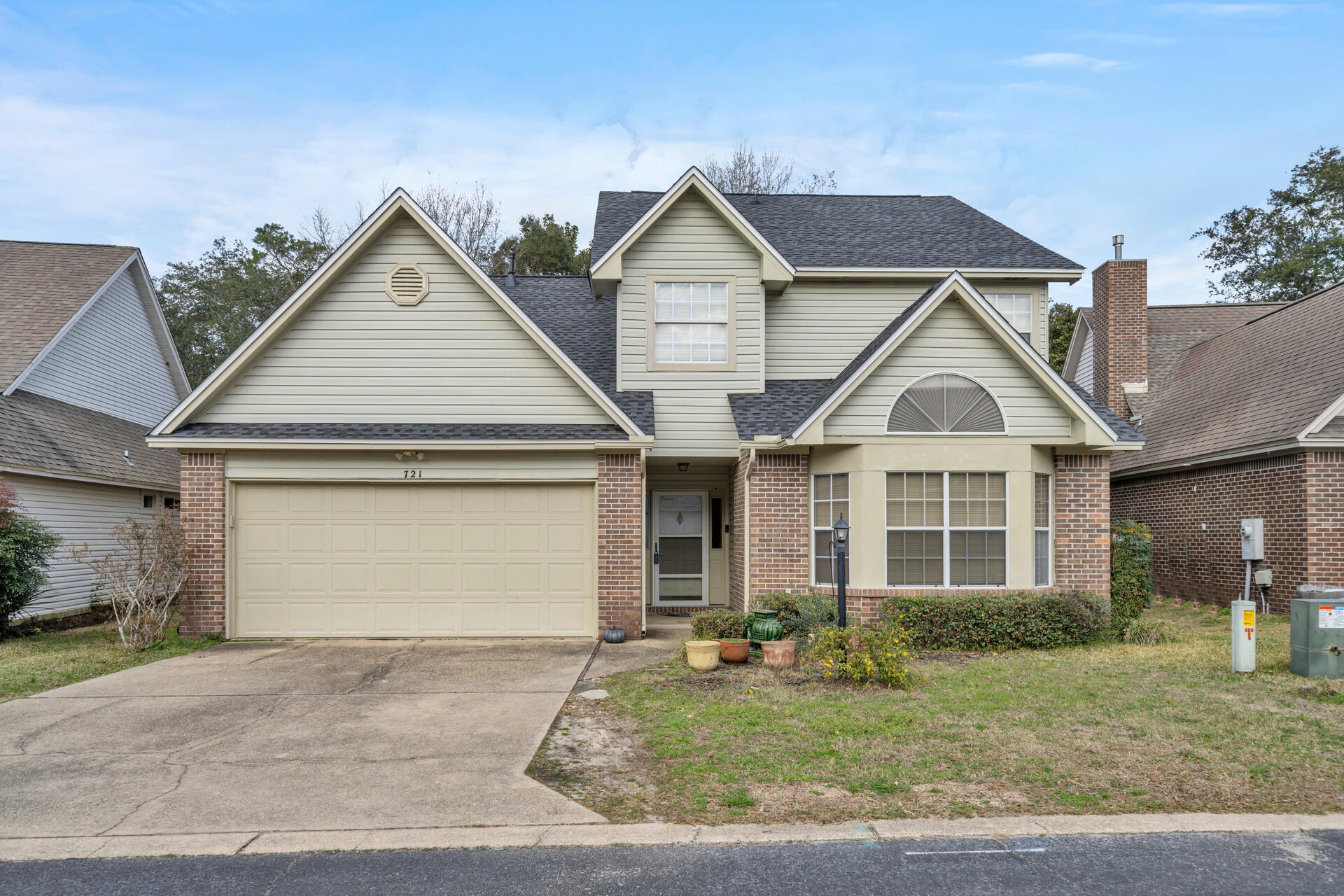 Beautiful home in the desirable neighborhood of Bluewater Bay is now on the market.  This all brick home has a recently remodeled gourmet kitchen including stainless steel appliances, quartz counter tops, tile back splash and soft close cabinets.  The spacious living room features a gas fireplace and sliding glass doors leading out to an enclosed sunroom.  The master also has an oversized walk-in closet that is sure to impress.  The 2nd level features 2 additional bedrooms and a bathroom.  The spacious backyard includes a Trex deck and ample room for an outdoor grill.  The home comes with a sprinkler system and a very large two car garage.  The location in Bluewater Bay is close to the tennis courts and amenities.  The water heater and roof were replaced in 2023.