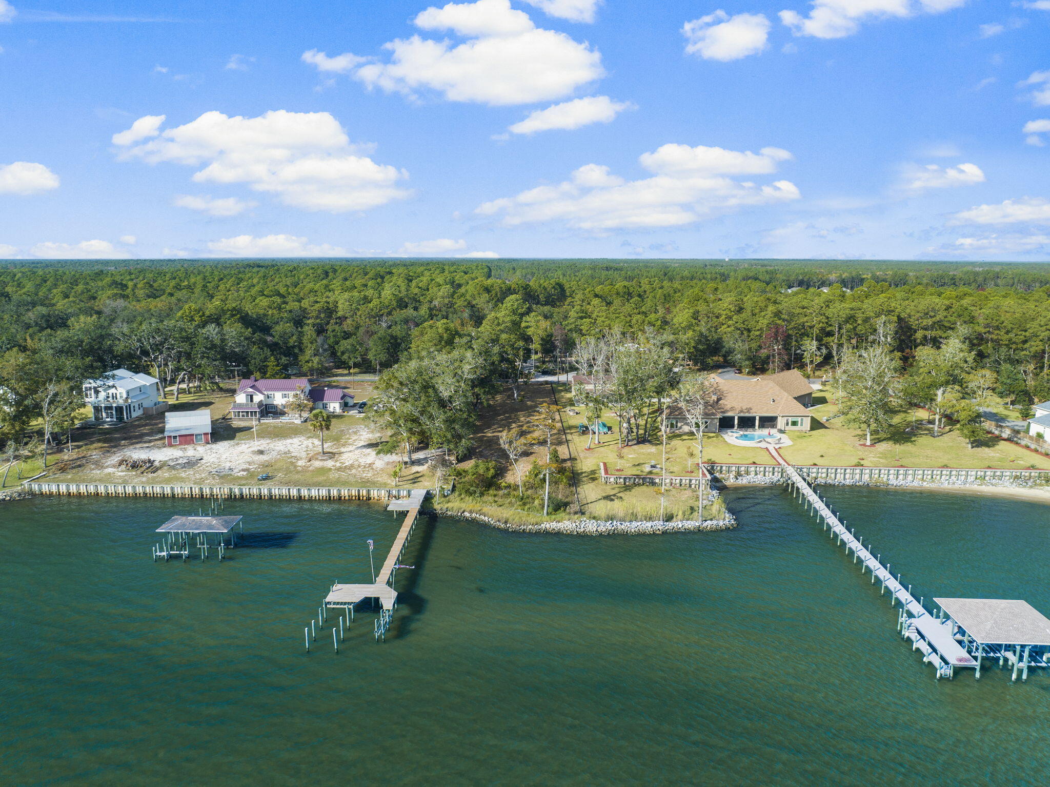 An Outstanding Investment Opportunity: Rare Bayfront Lot in Freeport's Growing Market. As Freeport rapidly expands, opportunities to own bayfront property in a well-maintained neighborhood are becoming increasingly rare. This exceptional half-acre homesite on Red Barn Road offers stunning views of Choctawhatchee Bay and is an ideal investment in one of Florida's fastest-growing cities.  Nestled in a meticulously cared-for community with no HOA and located in Flood Zone X, this lot requires no flood insurance. A pre-installed rip-rap wall ensures shoreline stability and enhances the property's aesthetics. Even better, custom plans for a 5,246 sq ft home, specifically designed for this lot, are available to help you bring your waterfront dream to life. Enjoy a quick boat ride to Crab Island or the Intercoastal Waterway, making this an excellent location for relaxation and adventure. With Freeport's continued growth and this rare combination of features, this bayfront lot offers a place to call home and a smart, forward-thinking investment in your future. Survey available upon request.