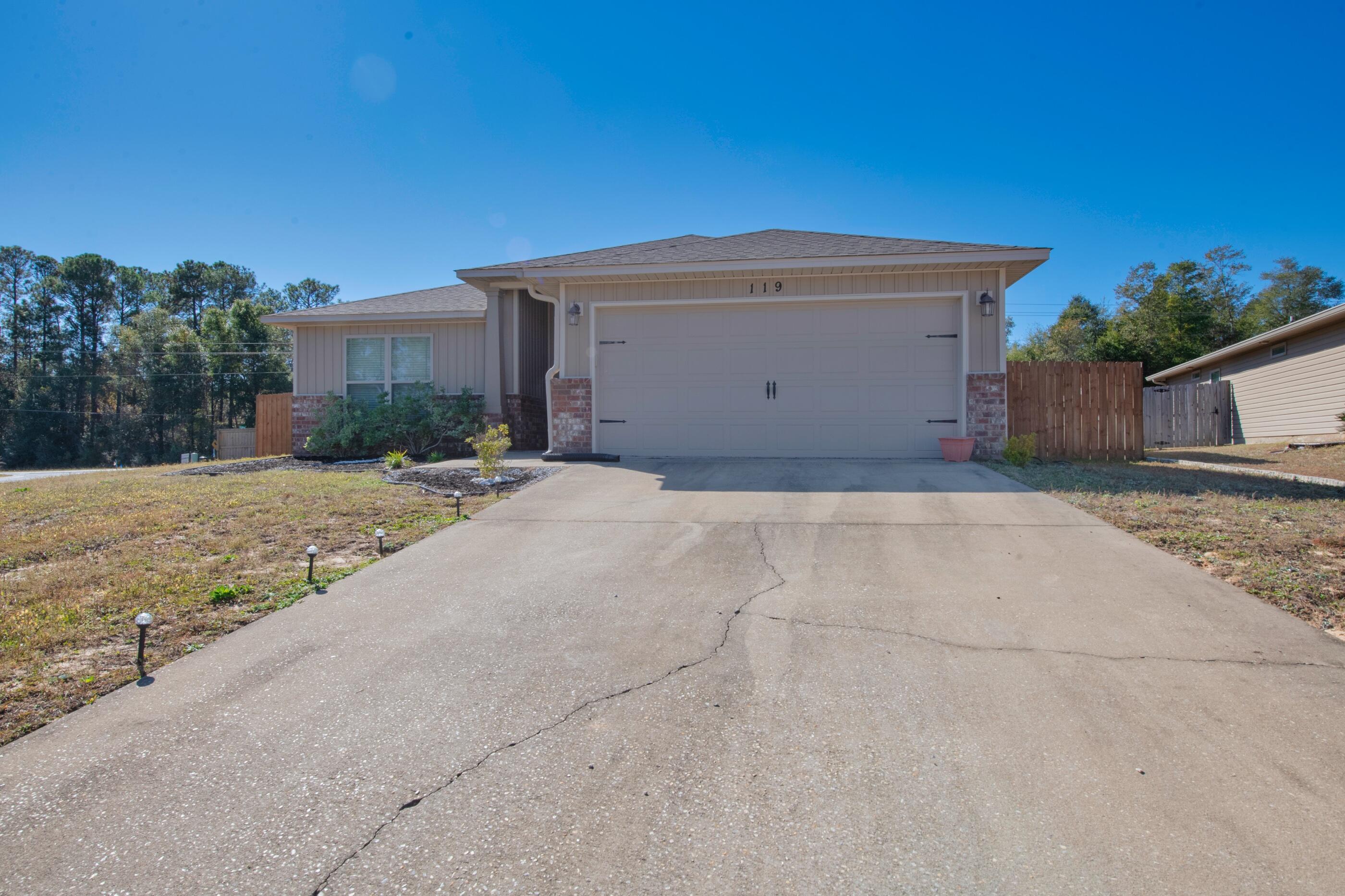 Better than new with oversized lot home, located South of I10 in Crestview! This home offers an open floor plan with a large eat in kitchen, stainless steel appliances, granite countertops, well sized living and dining area, spacious primary bedroom with ensuite bathroom, separate shower, garden tub, double vanities, and walk in closet! The home also features a fenced backyard as well as a covered back porch. This home offers a laundry room inside & a two car garage for additional parking, along with a large driveway. Schedule your showing today!