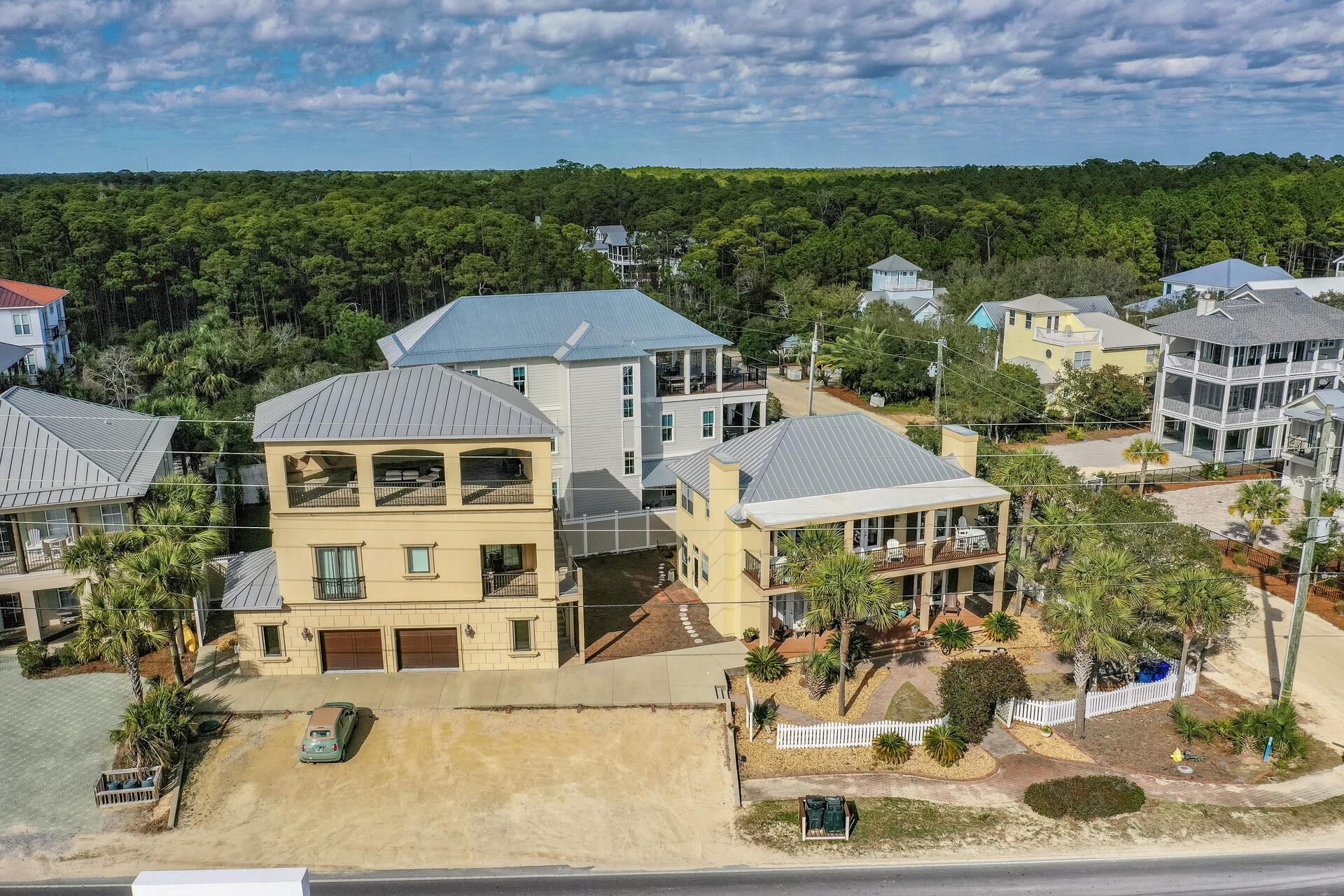 WOW! A very unique property  in Seagrove Beach affords the new owner to use both houses on the property as rental or family gatherings.  The main house is presently operated as The Seagrove Inn.  Charming and inviting the main house has 5 bedrooms each with its own ensuite bath.  The spacious kitchen has a chefs commercial gas range, over-sized granite island and large dining area. Decks off the second floor offer an opportunity to enjoy the Gulf and sea breezes.  Directly across 30A and only a few steps to the public  beach  access to Bramble Beach.  The other house on the property is a 3 story carriage house  with a first floor having a two car garage, laundry area and office space. The 3rd floor is totally open and covered  for outdoor  entertaining and viewing sunsets over the Gulf.