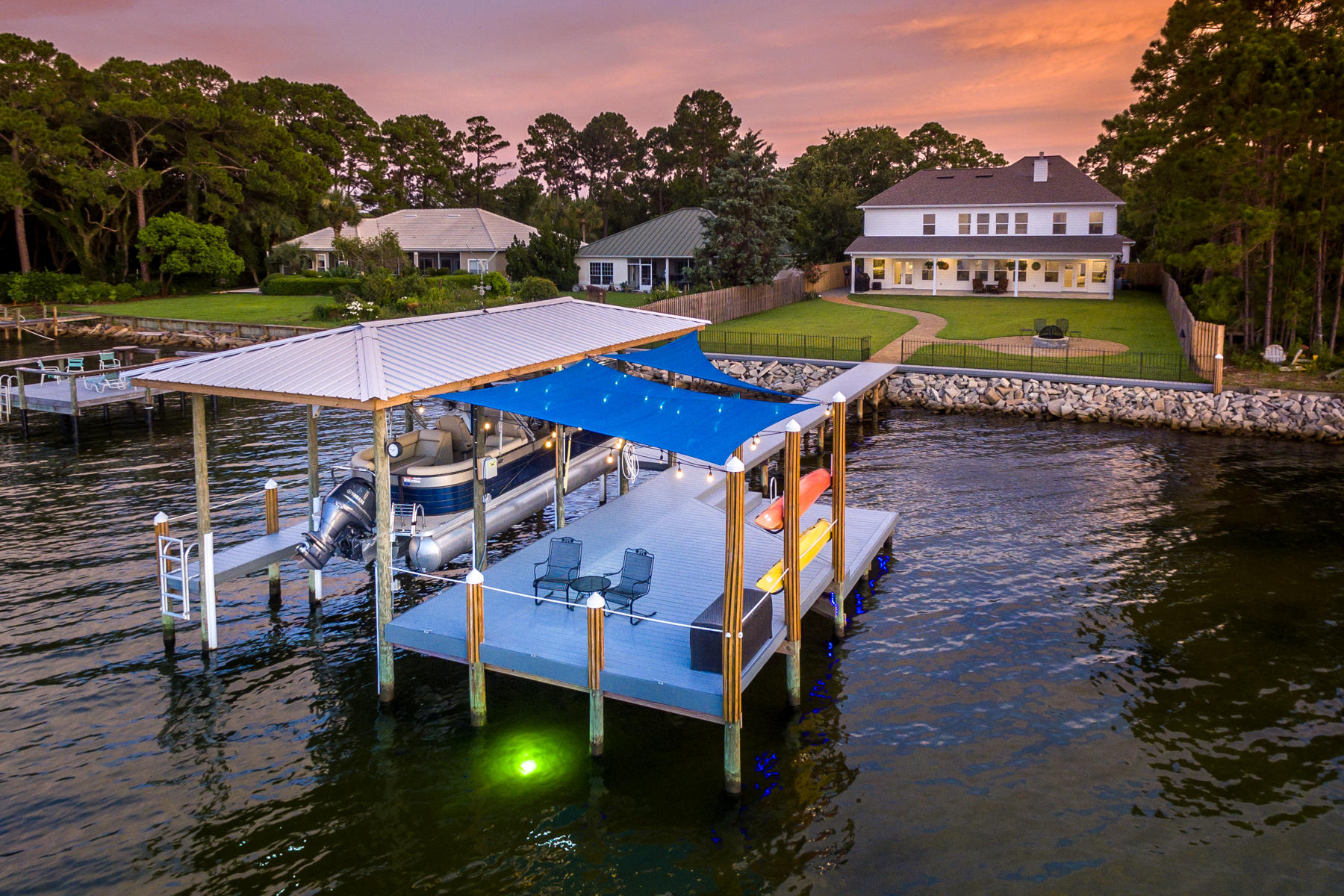 Why wait? Waterfront living at it's finest. NO HOA. This beautifully designed home has a coveted open floor plan. Choctawwatchee Bay is right out your backdoor. Plenty of room to add a large pool if you wish. Lots of natural light. Built with the latest hurricane standards. Home has exquisite finishes with granite, Electrolux stainless, gourmet kitchen, separate formal dining, custom tiled backsplash, Craftsman trim work and lighting, two Rinnai tankless gas hot water heaters, gas fireplace and Generac Backup Generator. Dog Friendly Lot. Unobstructed views. 265 Crest Drive Upgrades (Included in Sale Price)
Home: 4425 Sq. Ft.
Additional Detached 3-car Garage: 875 Sq. Ft. 
Total Covered Space: 5300 Sq. Ft. 
3 Car Detached Garage / Shop: 
"	35X25 = 875 Sq Ft
"	10' ceiling with 2"X6"walls
"	Separate power panel from house
"	Wired for 110V and 220V with multiple plugs in the walls, floor and ceiling
"	Air Compressor Lines run in wall and ceiling with outlets on the walls and ceiling.
"	Epoxied floor with Rust-Oleum RockSolid Gunmetal Metallic Garage Floor Coating 
"	LED recessed lighting
"	Shop sink
"	Gutters on all sides
"	Mitsubishi wall mounted heating and cooling unit

Attached 2 Car Garage with Additional Golf Cart Bay:
"	Resurfaced garage floor with Daich Spread Stone and clear epoxy giving it a marbled stone look
"	Two Wall Mounted fans
"	110V Plug for Golf Cart
"	110V Plug for Extra Refrigerator

House:
Study 
"	Ceiling fan with light kit
"	In wall wiring for TV 
Living Room
"	Ornate Mexican mahogany wood fireplace surround 
"	Floating shelves on both sides of fireplace with LED lighting and power outlets 
"	Remote control added for ceiling fan
"	In wall wiring for TV
Kitchen
"	Samsung Refrigerator
"	Upgraded downstairs thermostats to Honeywell TH321WF10D1/U WI-FI with outdoor sensor
"	Extra Shelf in pantry
"	Dimmer switches for island light pendants 

Laundry Room
"	Built in Ironing Board with 110V plug in Laundry Room
Bar Area
"	Dimmer switch for bar light
Dining Room
"	Dimmer switch for chandelier 
Master Bedroom / Bath
"	Upgraded thermostat to Honeywell TH321WF10D1/U WI-FI with remote room sensor and outdoor sensor
"	Blinds on bedroom windows and doors
"	Lighted Makeup Mirror in Master Bath
"	In wall wiring for TV


Upstairs Bedrooms/Bathrooms and Media Room
"	Ceiling fans with light kits in all 4 bedrooms and ceiling fan in Media room
"	Glass Shower Doors added in both upstairs bathrooms
"	Media Equipment Cabinet from Mexico
"	In wall wiring for TV


Outside Front
"	Generac Generator
"	Full house surge protector
"	Full house gutters
"	Pavers extended around new detached 3 car garage and side of house 
"	Resurfaced Front porch Daich Spread Stone and clear seal giving it a marbled stone look
"	Landscaping
Outside Back
"	New back yard fire pit with grate and full screen
"	Pavers extended by outside shower with a pathway to the fire pit and dock
"	New wood fencing alongside of house by new pavers and extending down to sea wall 
"	3 Outside LED flood lights  both sides and back
"	Resurfaced Back porch with Daich Spread Stone and clear seal giving it a marbled stone look
"	4 Outdoor Ceiling fans on back porch
"	Back porch sunshade
"	In- ground irrigation pump with American Hydro Systems 2650 30-Gallon GreenFeeder Siphoning Feeder System.
"	Landscaping
Dock
"	Wrought iron fence with gate along seawall
"	New seawall cap /walkway 
"	Rebuilt Dock and added Swim Platform 
"	Added Metal boathouse roof
"	Pelican wind vane on boathouse roof
"	6 Dock 6' bumpers lining interior pilings of the boat house 
"	Multiple 8" boat cleats around dock
"	Pilings wrapped in wood and capped with white caps 
"	White Rope between pilings
"	6000-pound Beltless boat lift with Remote and Auto Stop
"	Water to dock with separate cut off from house
"	Power to dock  110V and 220V (110V Lights and Outlets / 220V Boat Lift)
"	5 LED Dock flood lights
"	LED blue rope lighting wrapping the underside of the dock with timer
"	Deep glow green underwater dock fishing light on timer
"	Two kayak racks with cable locks 
"	2 Blue Dock Sunshades
"	Outdoor Italian bistro style LED string lights
"	2 Dock ladders
"	Storage box

Water Toys are Negotiable or Convey with Full Price Offer
"	2018 250 Crest II SLC Salt Water Series Pontoon Boat  25'  (3) 25" Round Tubes, Aluminum Underskin, SeaStar Hydraulic Steering, Junior Beast Ski Tow Bar - GPS Lowrance HOOK 4, Premium Audio, Full Boat Cover, Privacy Curtain & Frame  Seagrass Flooring  Dual 29" Highback Recliners - Dual Battery Switch - Coast Guard Kit - 150HP Yamaha with 20 hours of operation
"	2 Old Town Heron 11XT Kayaks with Paddles and Life Vests
"	4 TRC Recreation Super Soft Adjustable Recliners
"	2 Recreation Ultra Sunsation Floats