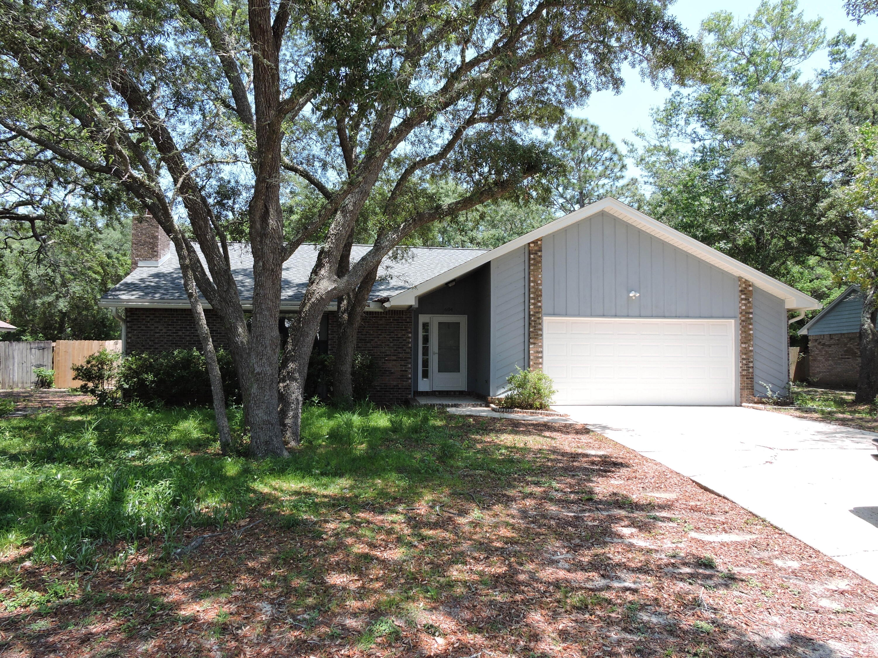 Available NOW! The home has been updated with new paint and beautiful LVP flooring throughout.  The family room features cathedral ceilings and accented with wood burning fireplace and open up to dining room with french doors to access the large patio in the backyard.  The kitchen features new stainless steel appliance package and a large kitchen island.  The master suite features and large walk in closet, separate dressing and shower area.  The additional bedrooms are nice sized with ample closet space.  Schedule your showings today!