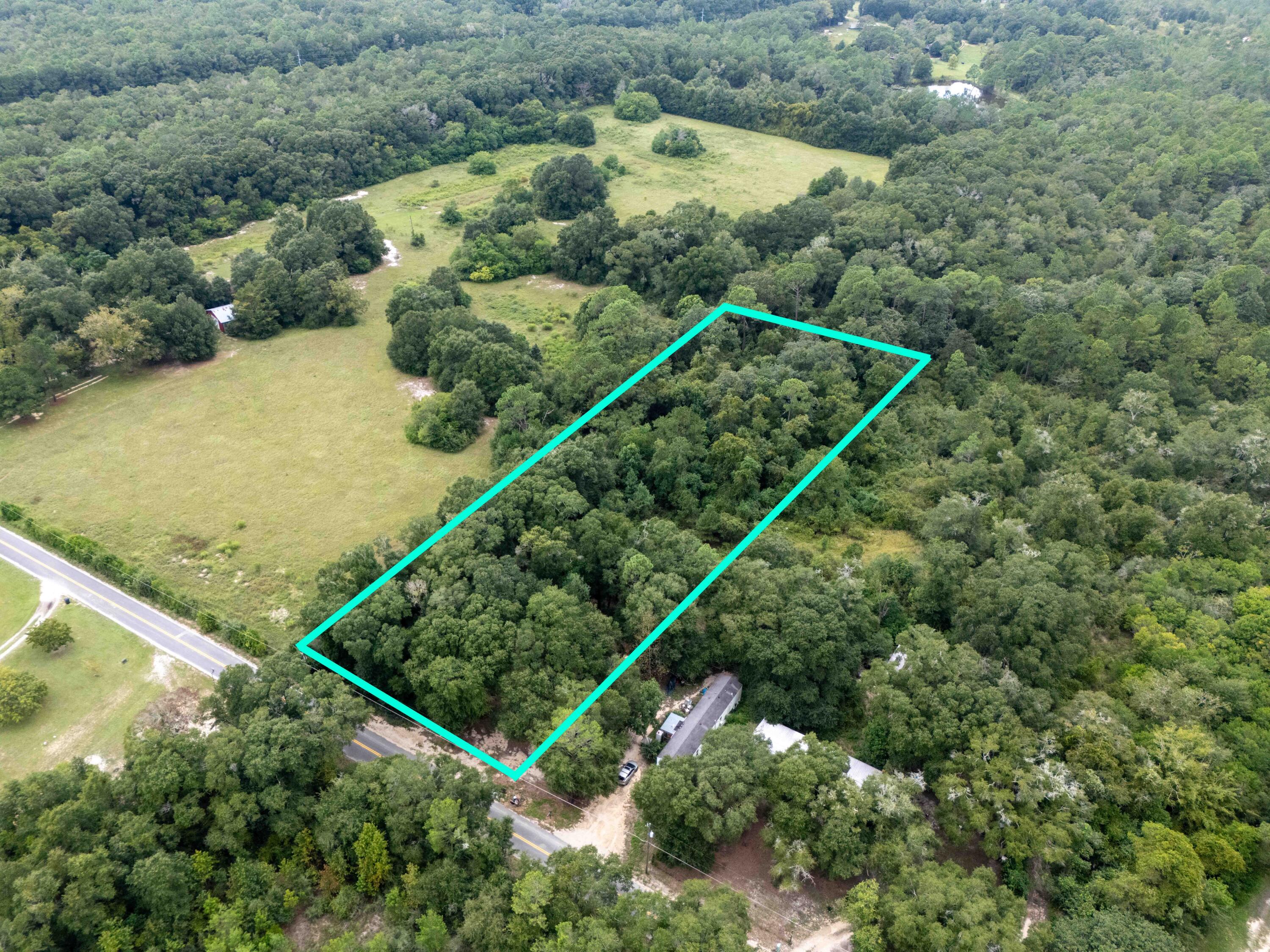 Can you get 2 full acres for $37,500 just 5 minutes from downtown DeFuniak Springs? Yes, it's true! This property is located just outside the city limits and welcomes your new build or your manufactured home.  The front is mostly flat with a gentle fall to the rear of the lot - this could make for some really lovely views with a little extra clearing. Buy now and hold for investment as this part of the world continues to grow.