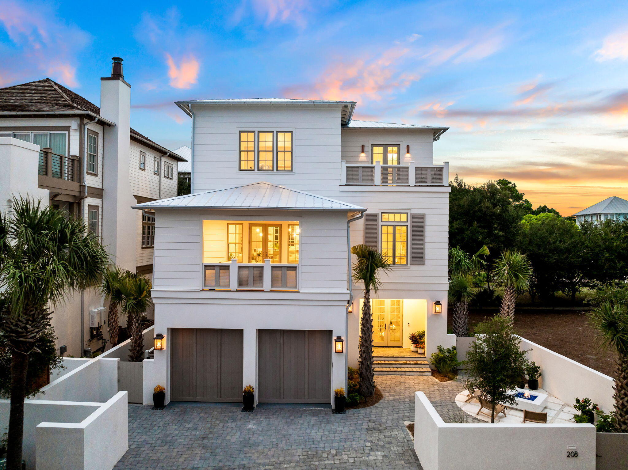 Gulf views and an enviable location within the private gated enclave of Seanest Village in Seagrove Beach define this newly constructed masterpiece by 30 North Design, executed by the renowned team at Focus Construction. This exclusive community offers dedicated beach access, placing the sugar-white sands and emerald waters of the Gulf just moments away. Positioned within walking distance to the new Greenway Station town center, you'll enjoy immediate access to an array of dining, shopping, and entertainment options, while the picturesque town of Seaside is only a short bike ride from your doorstep.

This home is crafted for those who appreciate quality craftsmanship and a thoughtful floor plan, offering Gulf views and exquisite attention to detail throughout. Upon initial approach, the gas lantern-lit courtyard with a built-in fire pit and double front doors welcomes you into an impressive entry foyer featuring Venetian plaster surfaces and stunning European wide plank white oak hardwood floors carried throughout the residence. The first floor offers 10' ceilings and includes two junior suites equipped with dedicated ensuites boasting custom floating vanities with under-cabinet lighting, beautifully tiled showers, and custom-built closets. A bunk room designed to accommodate six, a laundry room, and a two-car garage complete this level. The home is steps away from the community pool, enhancing its resort-like feel.

Ascending the striking staircase with hand-fabricated custom railings, or taking the full-service elevator, the heart of the home unfolds on the second floor with a sophisticated living space meticulously designed for both relaxation and entertainment. A gas fireplace, Pecky Cypress beamed ceilings, and warm wood tones infuse the space with coastal ambiance. The gourmet kitchen encompasses custom Marquis Fine Cabinetry, quartz countertops, an extended kitchen island with integrated seating, a hidden pantry, and a luxury appliance suite. The covered outdoor living area on this level, complete with Ipe decking, a summer kitchen, TV, and fireplace, beckons for gatherings or quiet evenings outdoors. Guest quarters with dedicated ensuites, a wet bar, and a reading area also grace the second floor.

Anchored by a wall of windows showcasing beautiful Gulf views, the extraordinary main suite situated on the third level is synonymous with relaxation. This suite features soaring vaulted ceilings with Pecky Cypress accents, a dedicated flex space perfect for a home gym or office, double closets, and a private washer and dryer in the closet. The luxurious ensuite bath is designed for a spa-like experience with a garden-style soaking tub, dual vanities, a large walk-in shower with dual showerheads, a rainfall showerhead, and an enclosed water closet. A beverage bar and two generously sized walk-in closets complete the main suite. The top-floor deck, designed for sunning, provides the perfect place to admire the picturesque Gulf views and the ever-changing palette of hues emitted by the renowned Emerald Coast sunsets.

208 Sand Oaks Circle conveys with private beach access for homeowners. This home, featuring solid core doors, landscape lighting, custom-built-in closets, and laundry on both the first floor and primary suite closet, is designed for those who appreciate quality craftsmanship and a well-thought-out floor plan. With impressive rental income projections of $185,000 per year, it presents a compelling opportunity for investors and full-time residents alike. The sought-after community of Seanest Village in Seagrove Beach on 30A provides residents with heightened privacy and an array of amenities while remaining geographically poised near all of the acclaimed dining and entertainment venues 30A has to offer, including the newly opened Greenway Station town center. Directly across the street, there is "Friends Corner," a free bike maintenance station offering a water fountain, dog watering station, and a rest area with a bench  perfect for those morning walks and bike rides. Inquire today to arrange a viewing and start envisioning the coastal lifestyle you deserve.