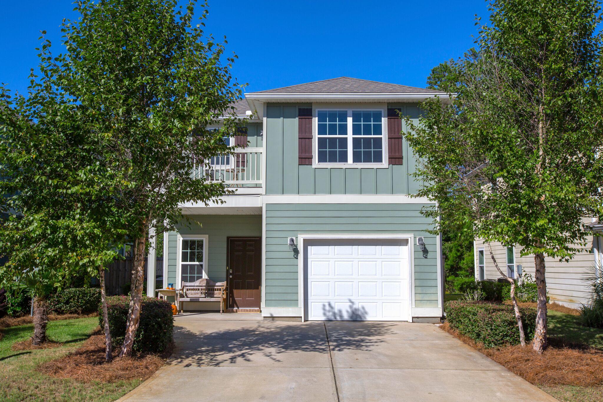 This meticulously maintained 3-bedroom 2.5 bath home is located in the centrally located subdivision of Plantation at Santa Rosa. Perfectly situated just off Highway 98, this adorable home screams beach lifestyle from the moment you pull in the driveway. The crisp, clean color palette and lush landscaping truly welcomes you home. Upon entry you will immediately notice the stunning upgrades throughout. The gorgeous dark hardwood floors give the home a warm and inviting feel while still allowing for a seamless flow through the open floor plan. The downstairs features open living, dining and kitchen area making this home great for entertaining.The kitchen features granite counter-tops, upgraded appliances and modern fixtures. The dining area features plenty of natural light, built in bench seating with storage and direct access to the outdoor patio. The large backyard is fully fenced in and gives you plenty of space for entertaining. As you make your way to the second floor you will find 3 bedrooms, 2 bathrooms, and laundry room are conveniently located upstairs. The master is open and bright with plenty of windows allowing for the perfect amount of natural light. You also have your own private balcony off your Master Bedroom that you can make your own little oasis.  It also features his and her walk-in closets both with ample space. The master bath showcases a separate shower and garden tub along with double vanities. Both baths feature granite counter-tops and plenty of cabinet space for storage. The home includes a spacious garage with additional storage space and sizable laundry room with built in shelving. This home has been extremely well kept and updated with everything you could ask for and is conveniently located to 30A, shops, restaurants and all things the beach lifestyle has to offer!! Not to mention, the community pool is beautiful!