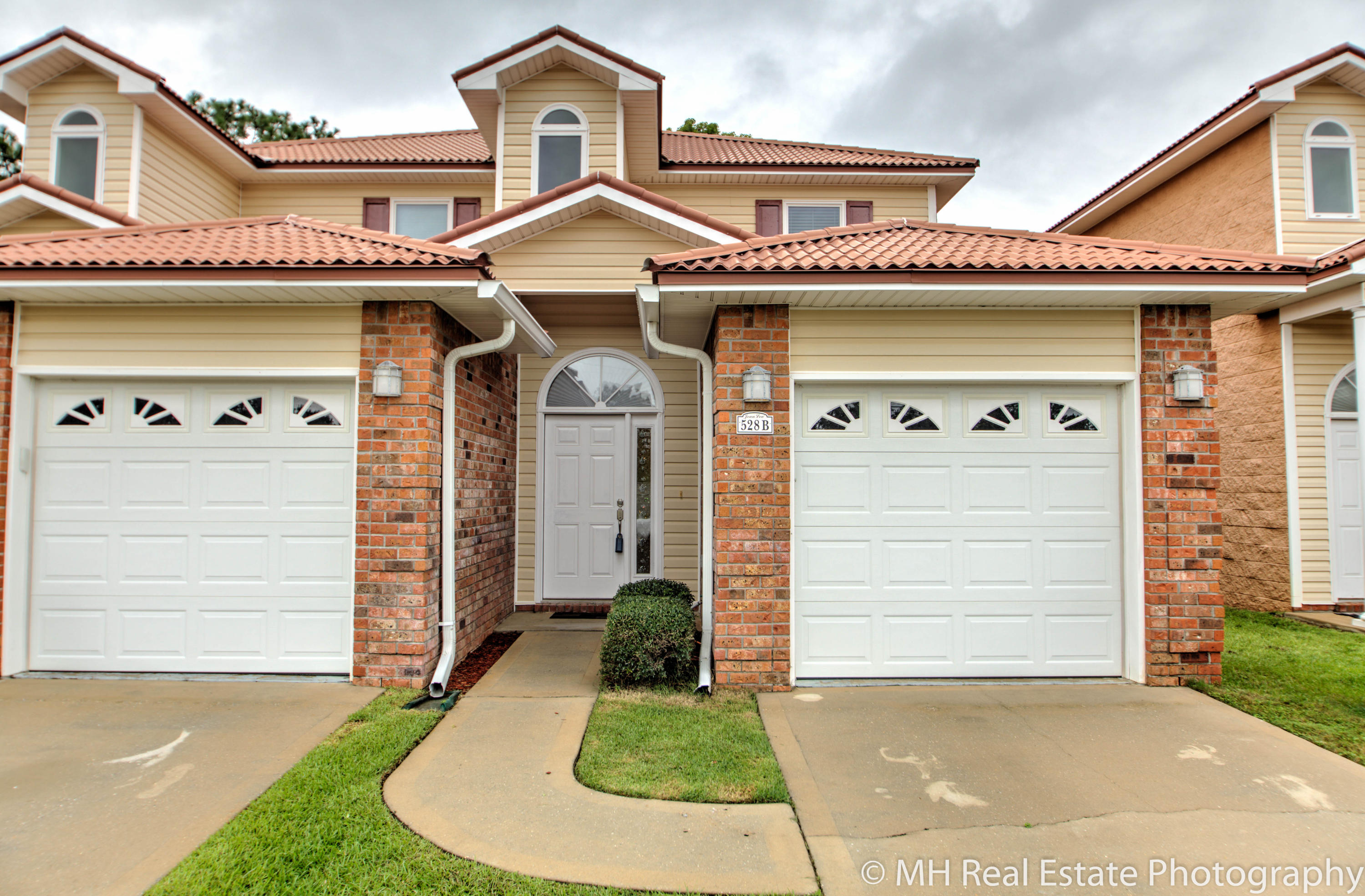 Extremely well built townhouse close to Eglin AFB. This 2 bedroom, 2.5 bathroom townhouse features 9 foot ceilings throughout. The kitchen features quality cabinets with soft close drawers and GRANITE as well as STAINLESS STEEL appliances. Downstairs features wood laminate floors and opens to a covered patio, perfect for grilling. Upstairs are 2 bedrooms, the secondary bedroom features a walk in closet while the master bedroom is spacious and features 2 closets including an oversized WALK IN CLOSET. Quality construction with concrete filled block walls and a metal roof that looks like barrel tiles. Come see this home today.