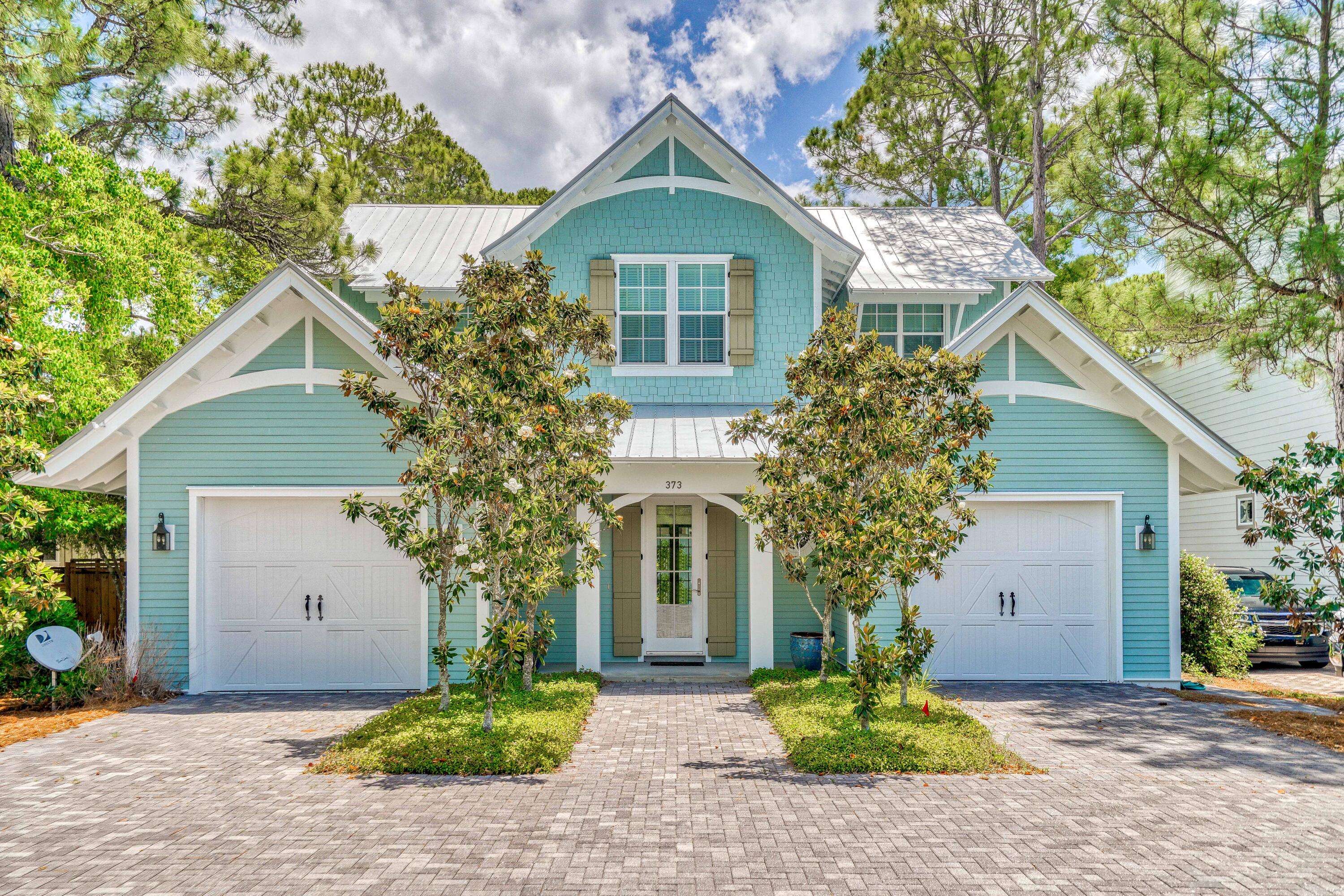 Well-appointed with custom features and exquisite architecture, 373 Lakewood Drive is a turn-key custom home completed in 2014. This one owner sophisticated property includes 3054 sq ft of perfectly crafted and planned living space that may only be topped by the outdoor living areas that surround like a true beach oasis. When entering the oversized welcoming foyer leads your eyes to a custom barrel vault ceiling and through to the great room. A chef's dream kitchen featuring double GE Monogram ovens, a 6 burner cooktop with griddle, and microwave drawer are among the many curated selections. Two sets of french doors and ample windows allow the beauty of the outside to shine through into the great room. A custom stucco gas fireplace adorns the great room and adds to the tasteful ambiance. The media room off the great room features double pocket doors and ample space to be used as an office, additional living room, or even bunk room. Seamlessly flowing down the hall you will find the inviting and revitalizing first floor master suite. UP the white oak staircase you will find a second master with an en-suite. 2 additional bedrooms and ample storage. 
Poised on a large lot, the outdoor space is dream-worthy, with climbing jasmine, bistro lighting,fruit trees, cluster bamboo and custom built metal privacy walls. Behind the privacy fence you will find an oversized gunite plunge pool and three separate porch spaces with cumaru (brazilian teak) flooring and an outdoor shower, perfect after a short stroll back from the beach. 
Additional features include: 
Whole house speaker system and outside wired for speakers as well.
Gas line for grill with built in timer. 
Tankless Hot Water system 
3 Zone HVAC System (Master, great room, and second floor)