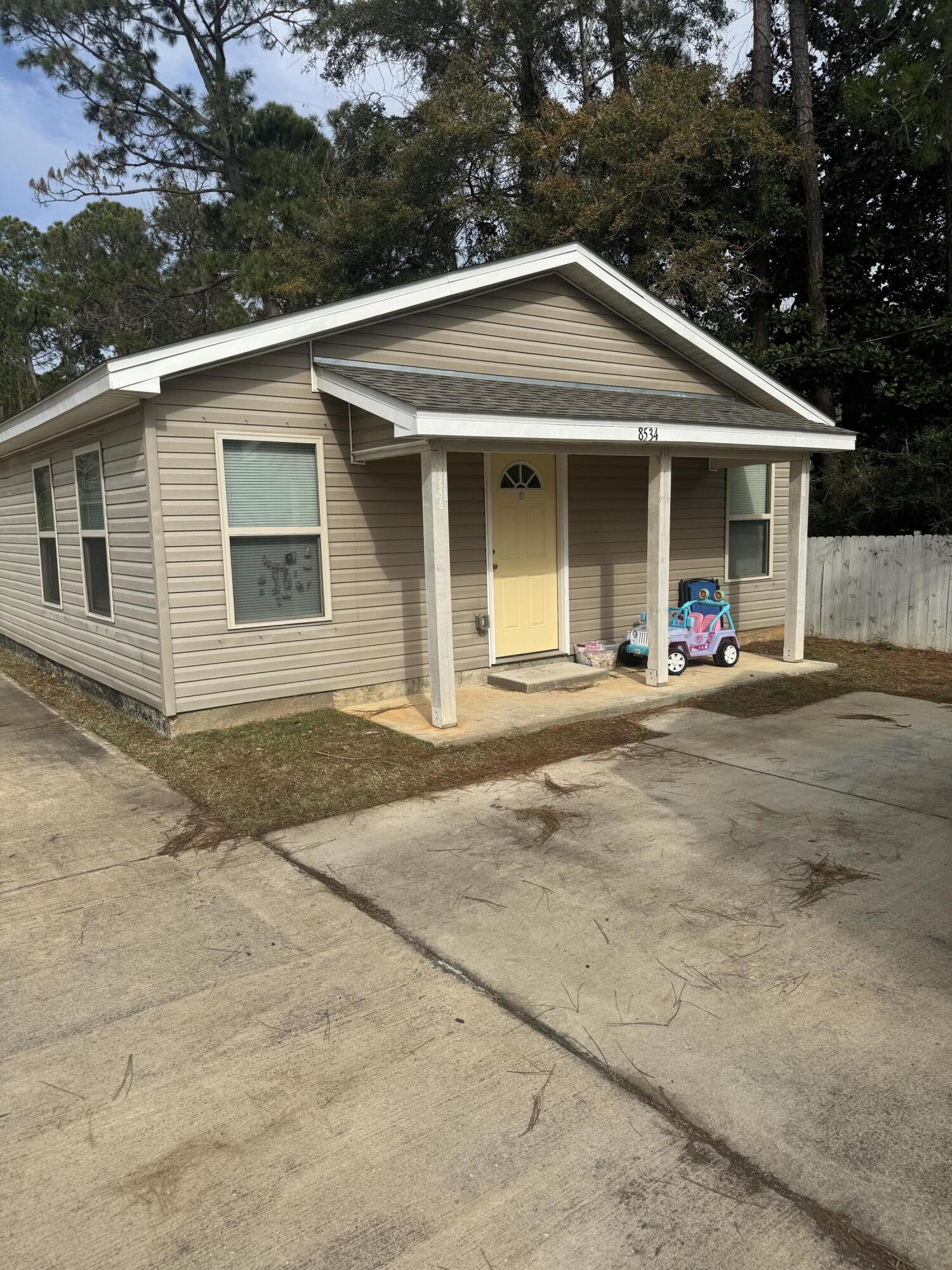 Great Starter Home or rental investment located about 2 miles to Navarre Beach. Offering 2 Bedrooms,  2 Baths with an open floor plan. Kitchen has granite countertops.  Short term rentals allowed. Property to be split prior to closing. Sale is for 8534 Laredo only.  Parcel ID and Legal description will be updated.